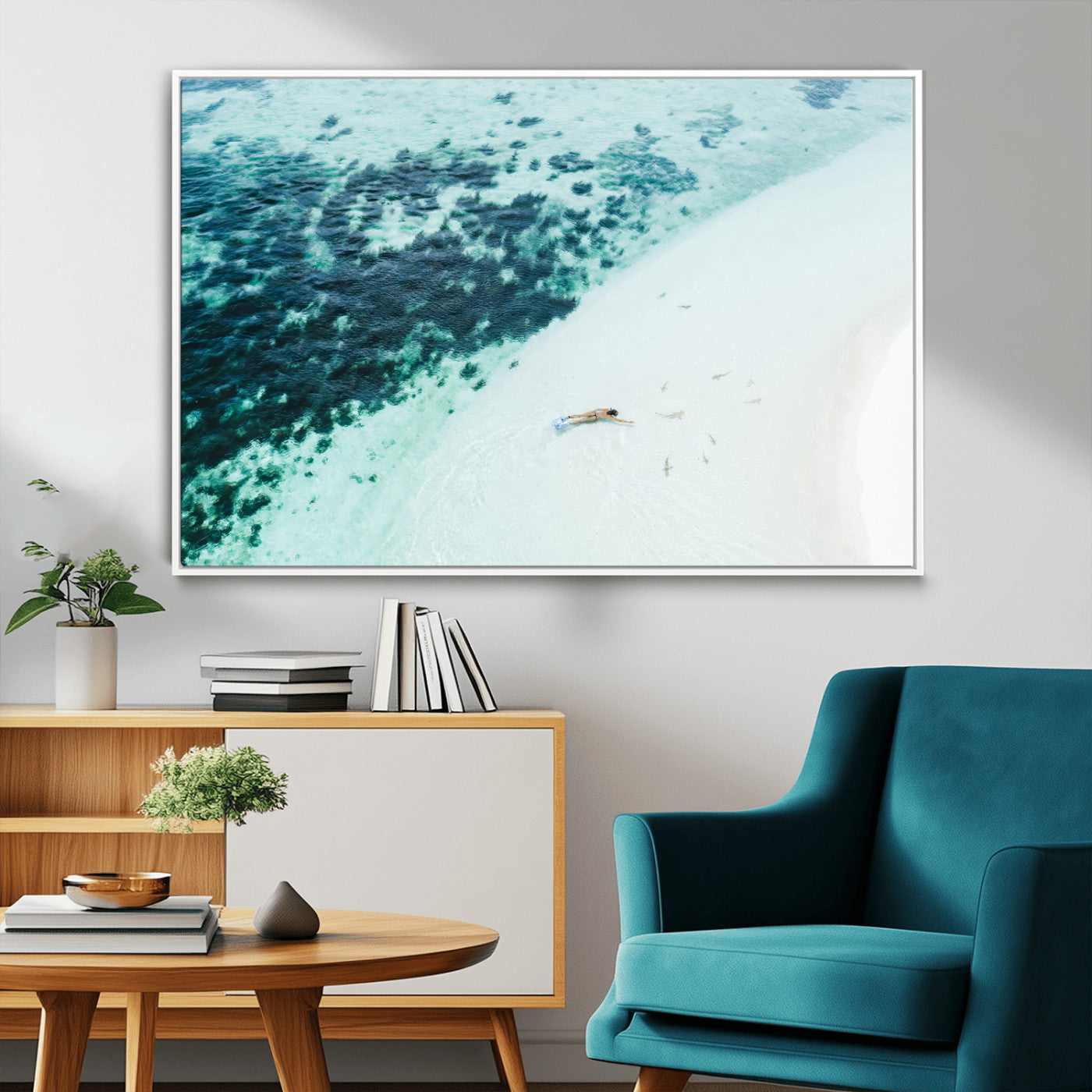 Canvas featuring an aerial view of a swimmer in shallow turquoise waters with coral patterns, ideal for tropical coastal home decor.