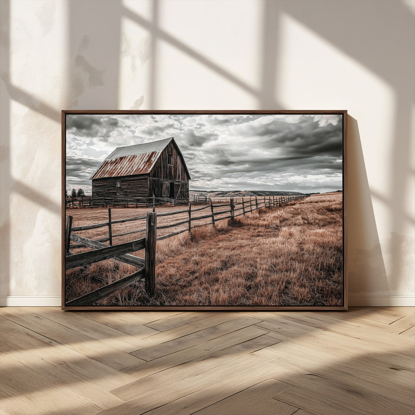 Framed canvas of a rustic barn under a moody sky with weathered fence and dark fields, ideal for farmhouse or rural-style wall decor.