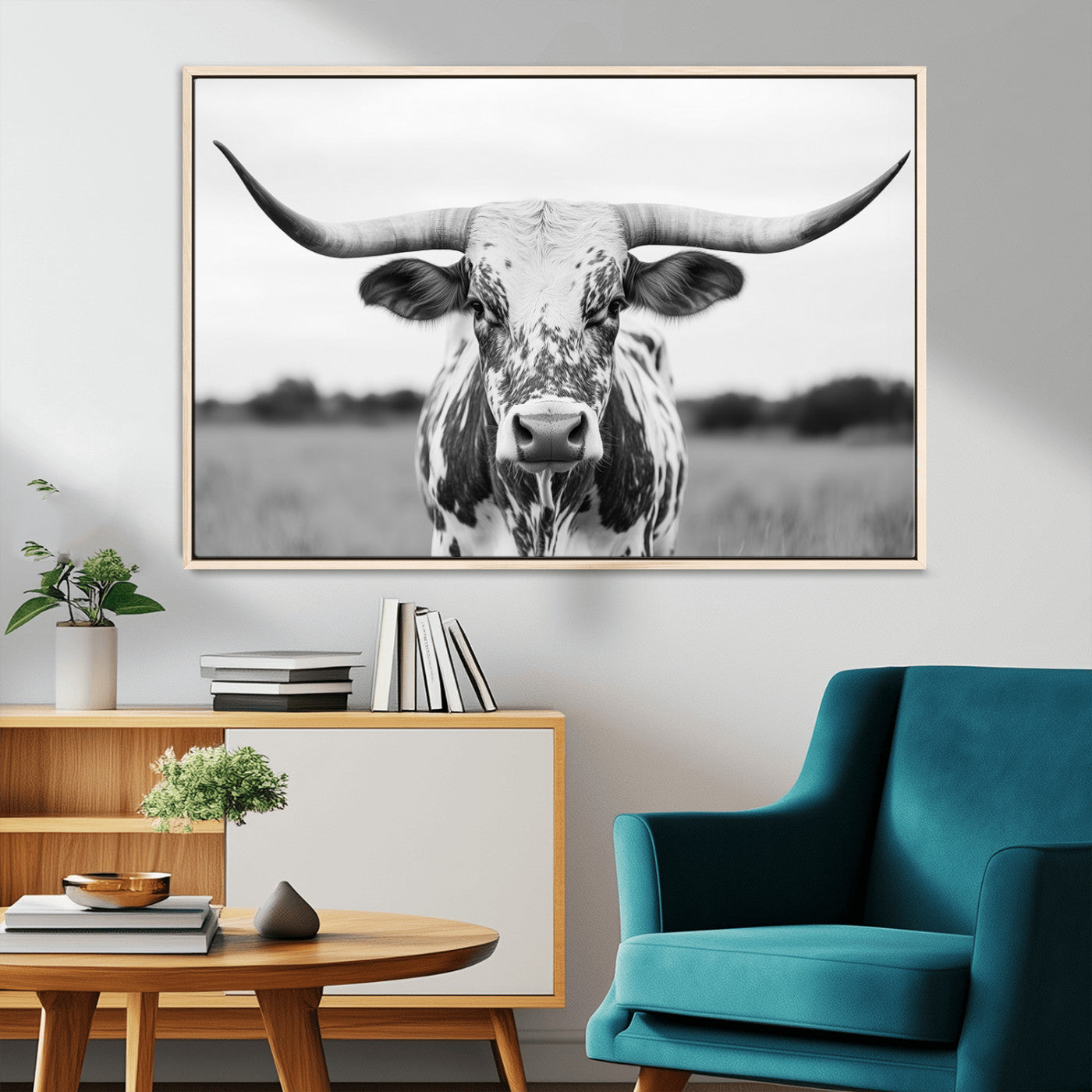 Capture the strength and elegance of nature with this striking black and white portrait of a longhorn cow. Its powerful presence makes a bold statement in any room.