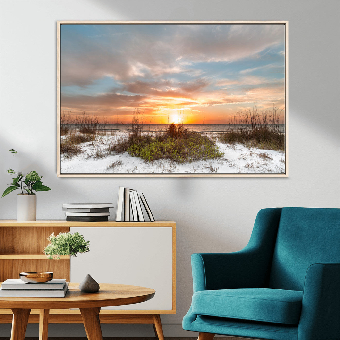 A tranquil beach scene featuring golden sunset hues over the water, with grasses in the foreground and a peaceful, serene atmosphere.