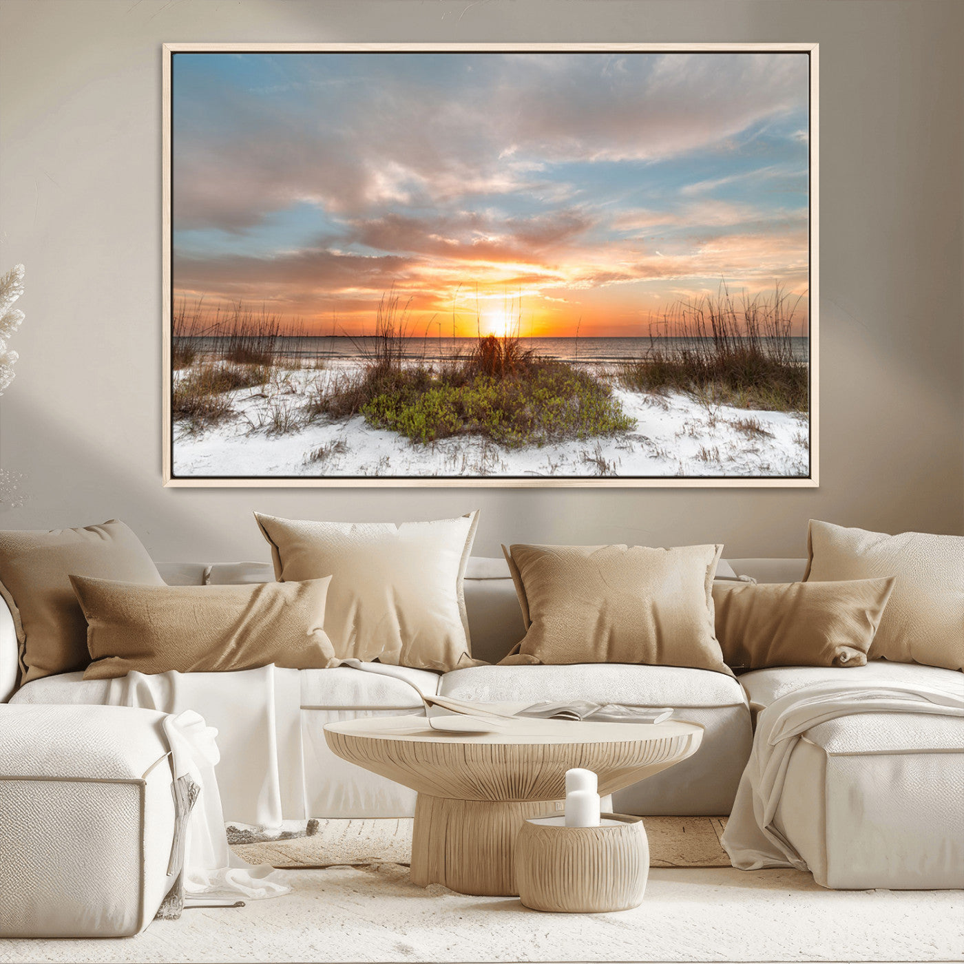 A tranquil beach scene featuring golden sunset hues over the water, with grasses in the foreground and a peaceful, serene atmosphere.