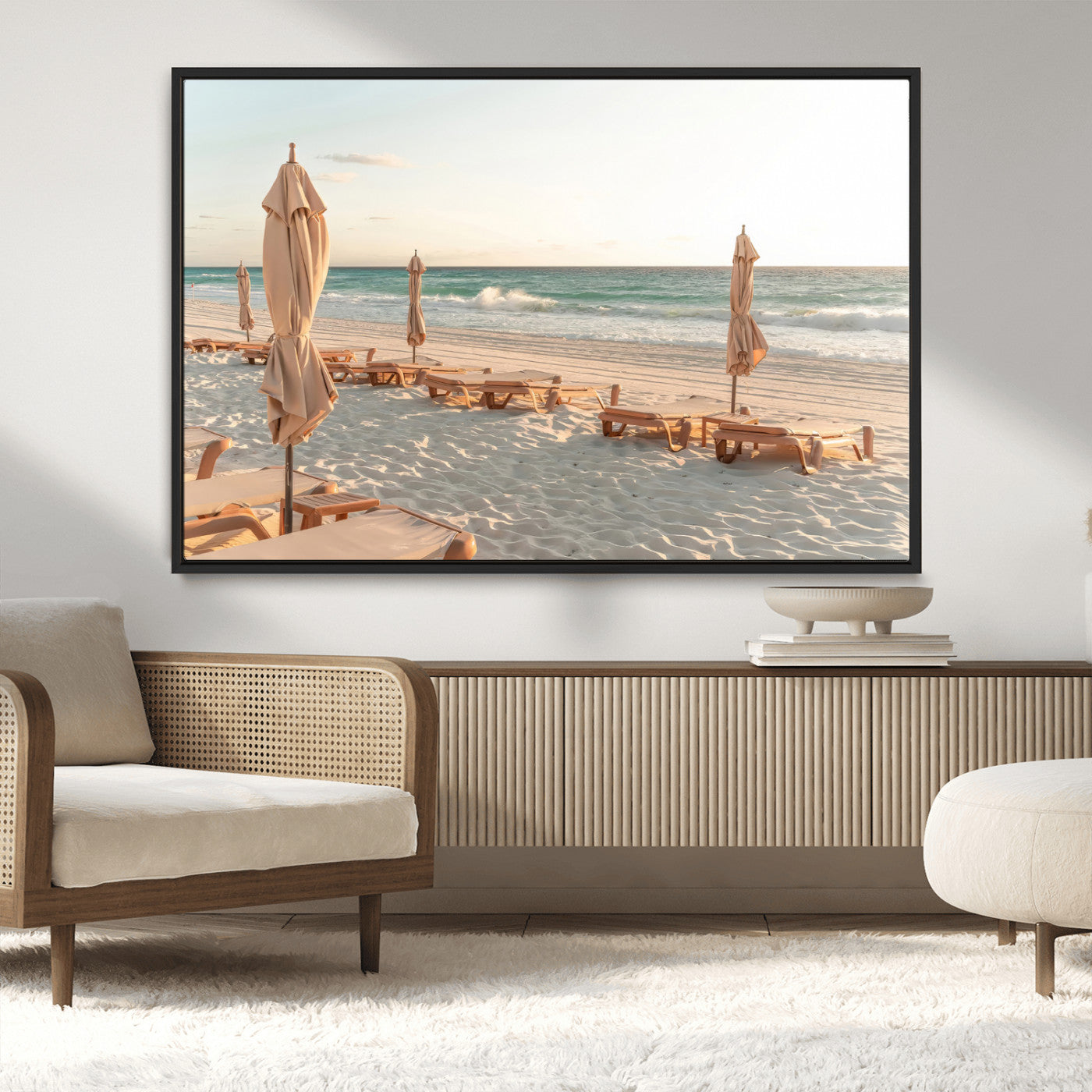Minimalist photo of empty beach loungers and umbrellas on soft sand, ideal for calm seaside or pastel coastal-style home decor.