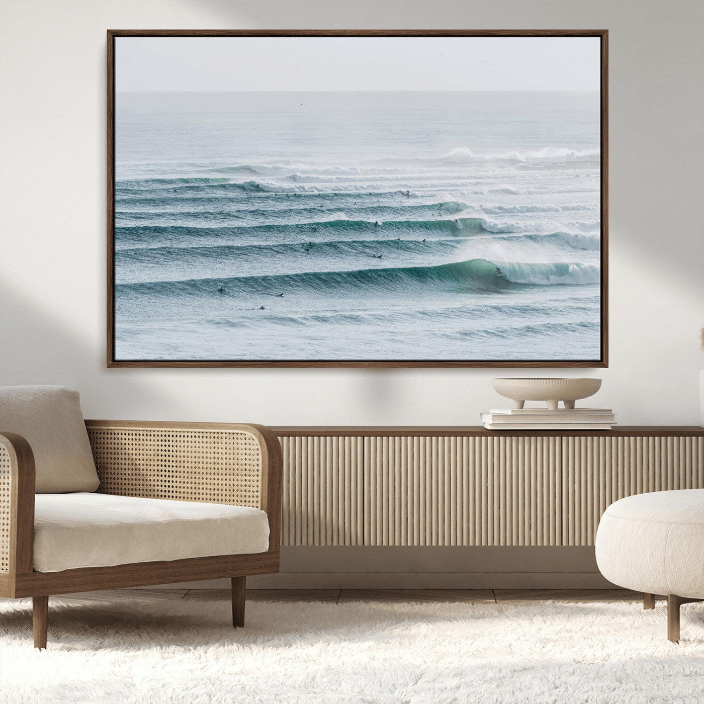 High-angle view of surfers lining up across layered ocean waves, ideal for minimal coastal or surf-inspired room decor.