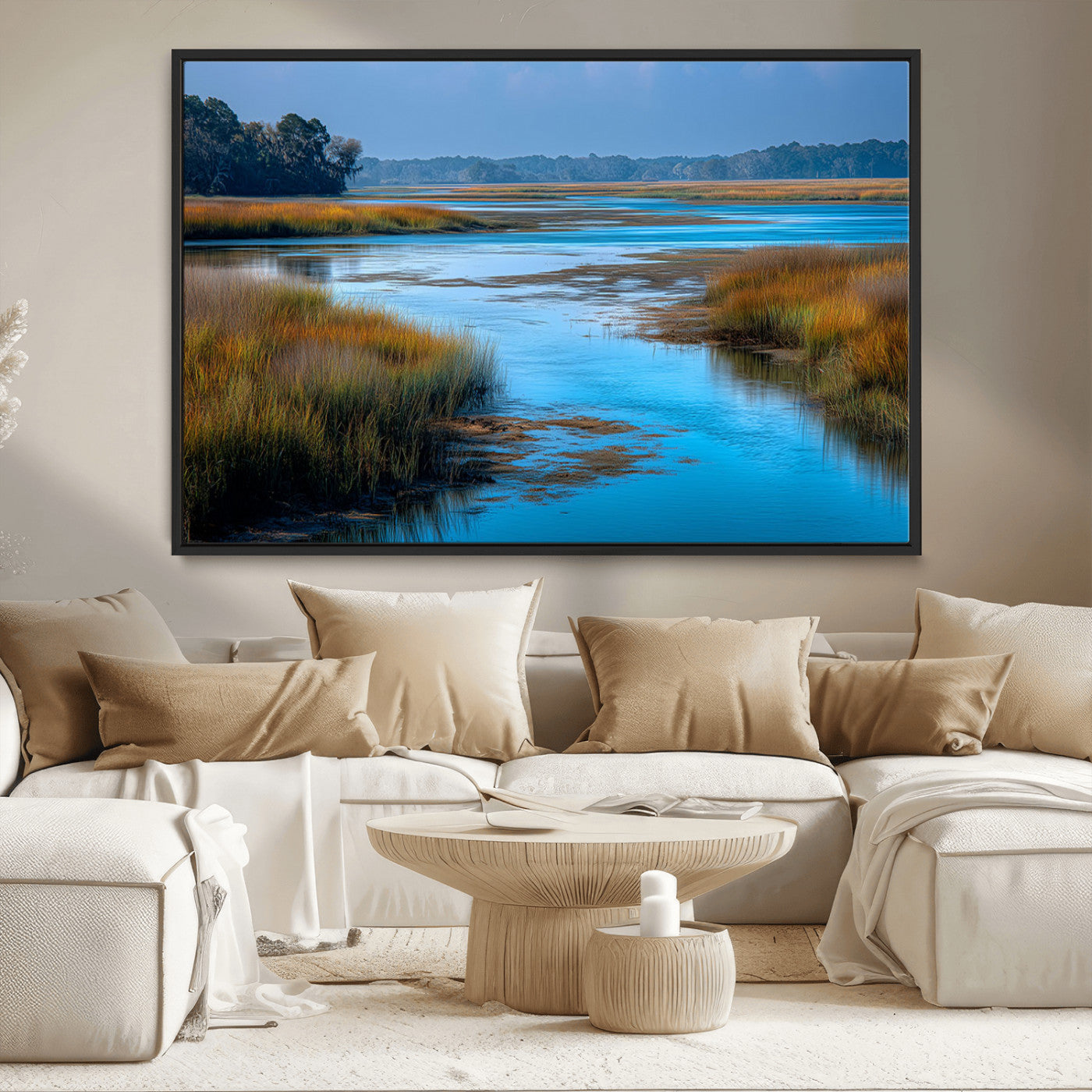 A peaceful marshland scene with calm blue water reflecting the surrounding grasses and trees, capturing the beauty of nature in a serene landscape.