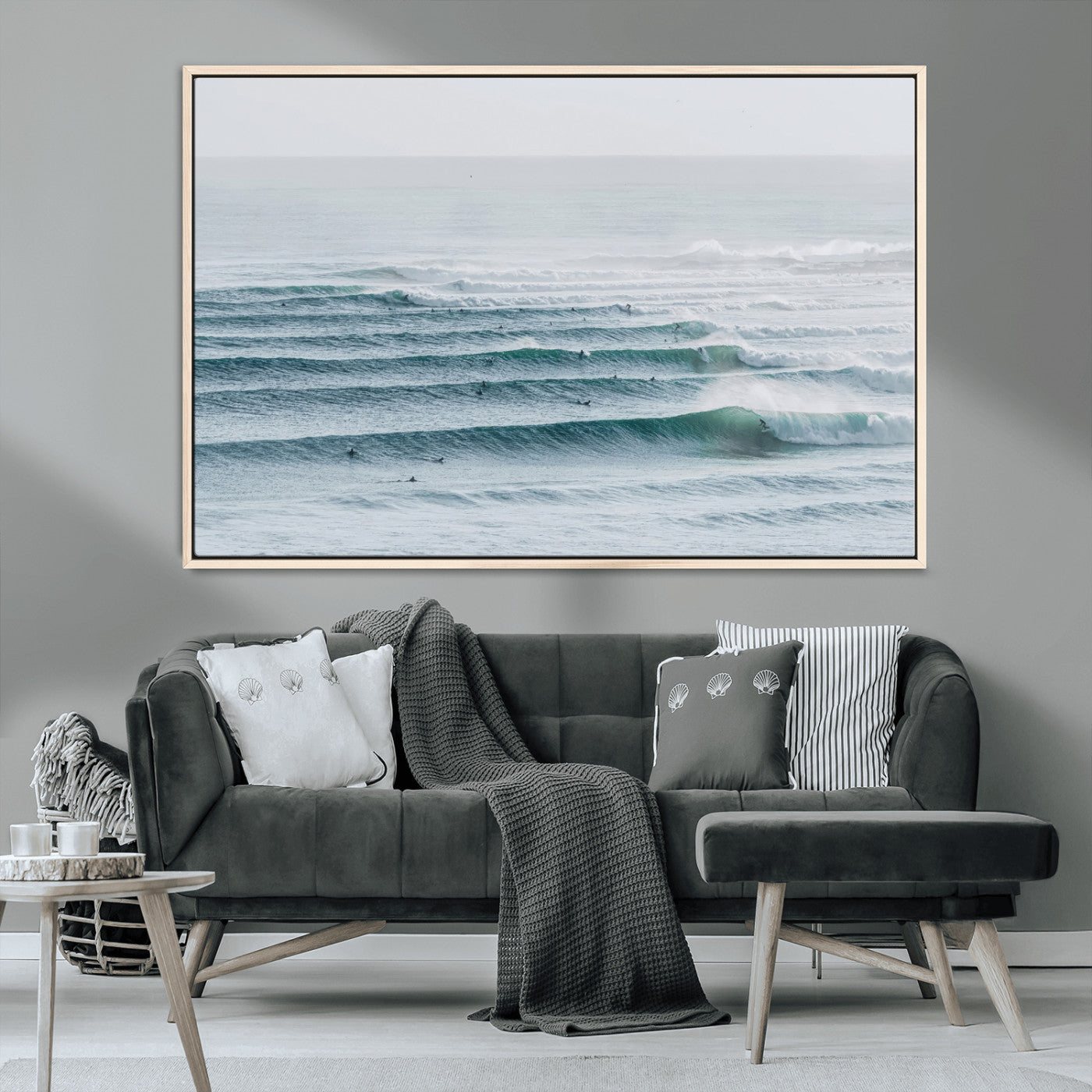 High-angle view of surfers lining up across layered ocean waves, ideal for minimal coastal or surf-inspired room decor.