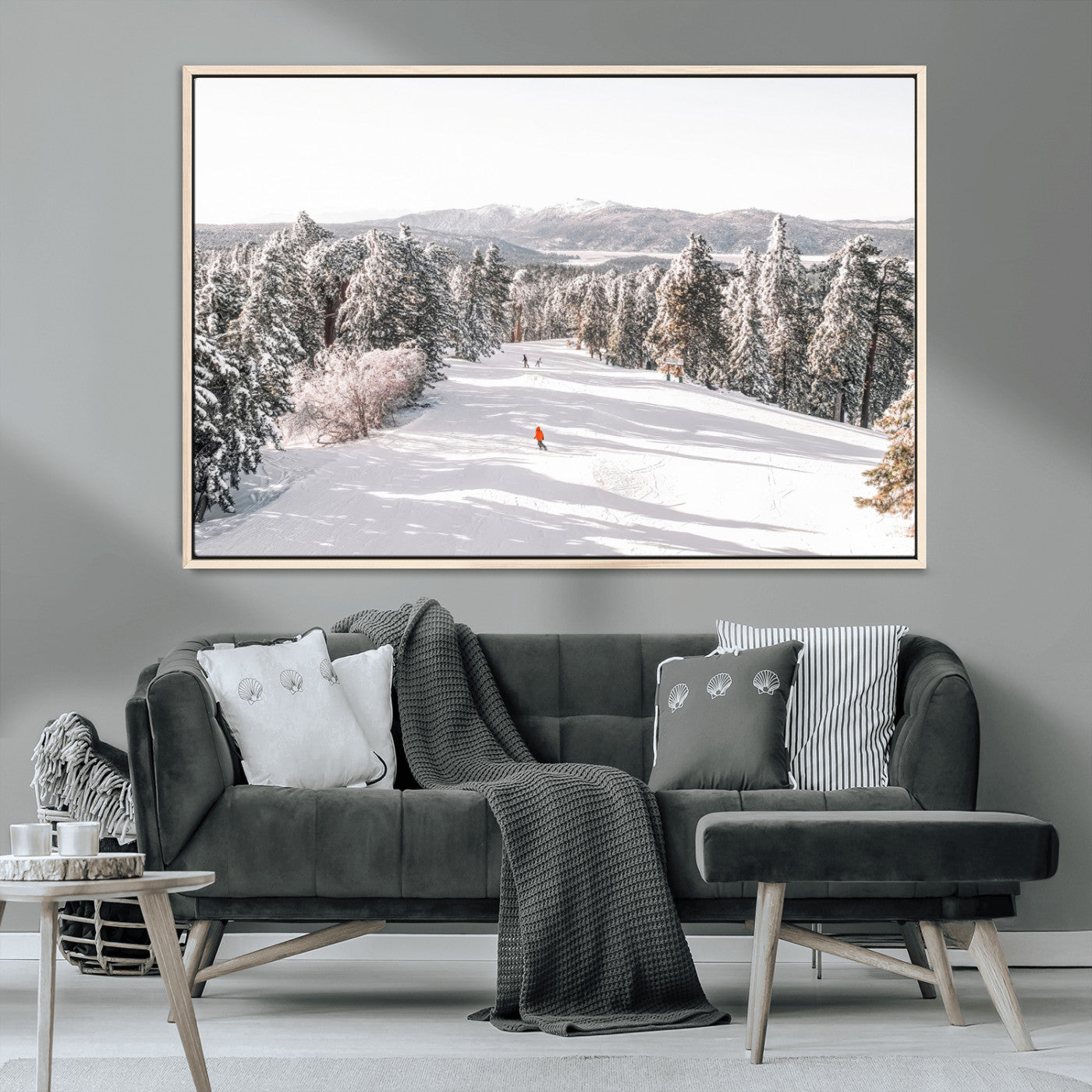 Bright ski trail lined with snow-covered pines and a skier in orange, perfect for alpine adventure or winter sports-inspired decor.