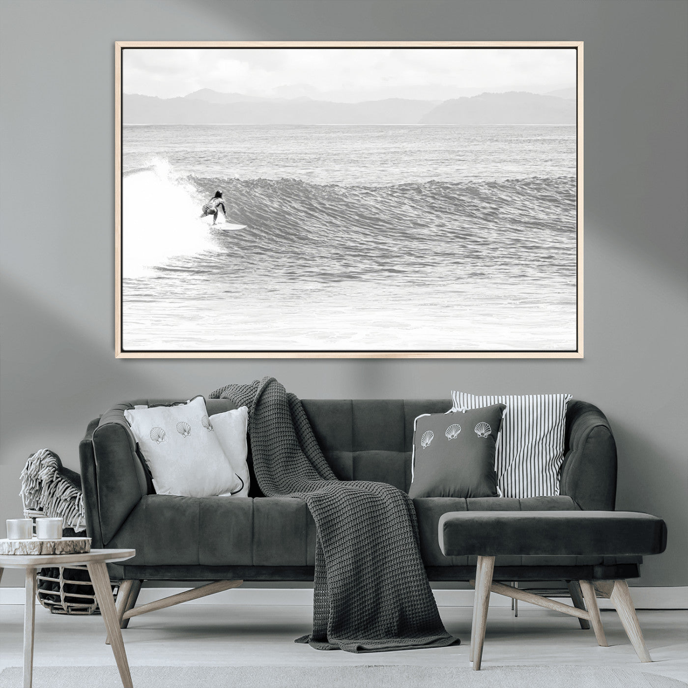 Monochrome photo of a surfer riding a wave with distant mountains, ideal for coastal motion or black and white surf-themed wall decor.