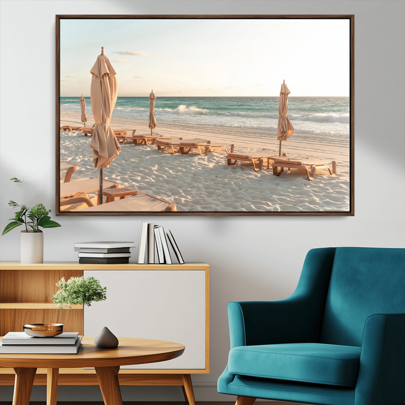 Minimalist photo of empty beach loungers and umbrellas on soft sand, ideal for calm seaside or pastel coastal-style home decor.