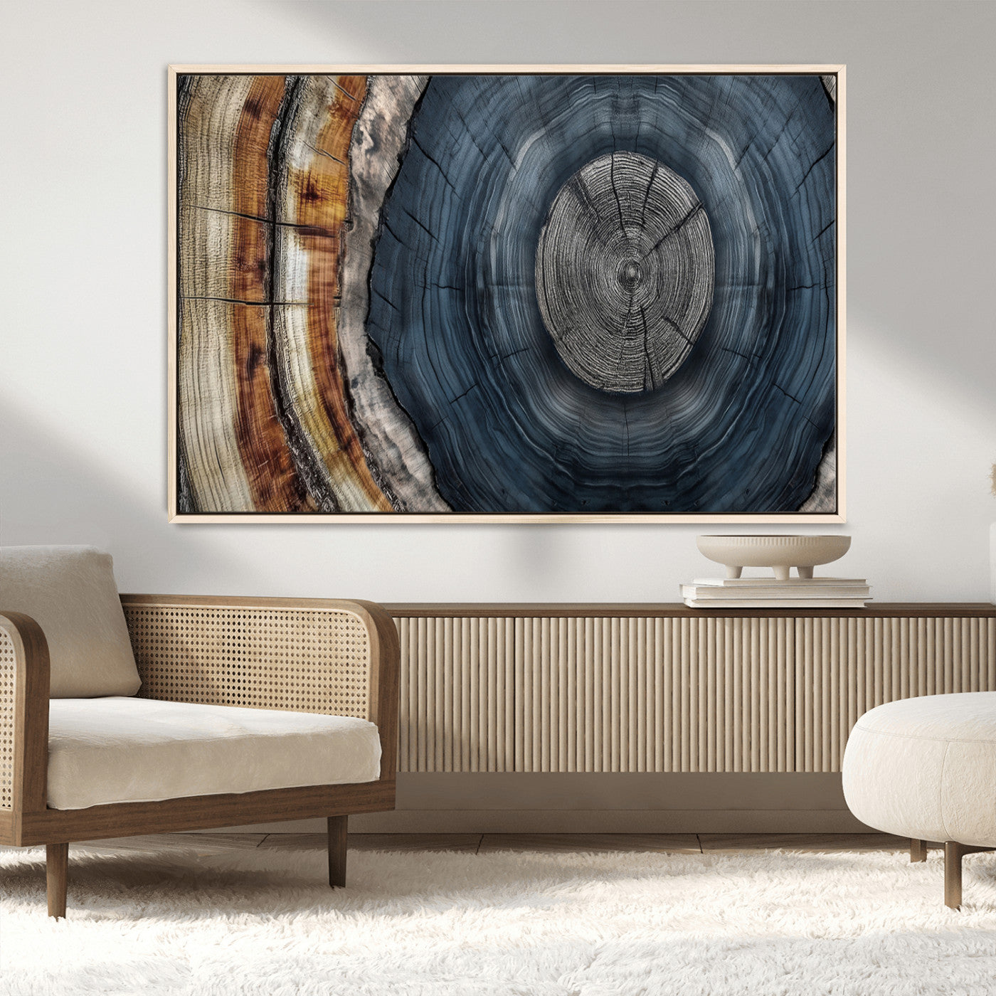 A stunning close-up of a tree trunk showing the intricate, circular growth rings, showcasing the natural textures and rich contrasts in deep blues, browns, and silvers.