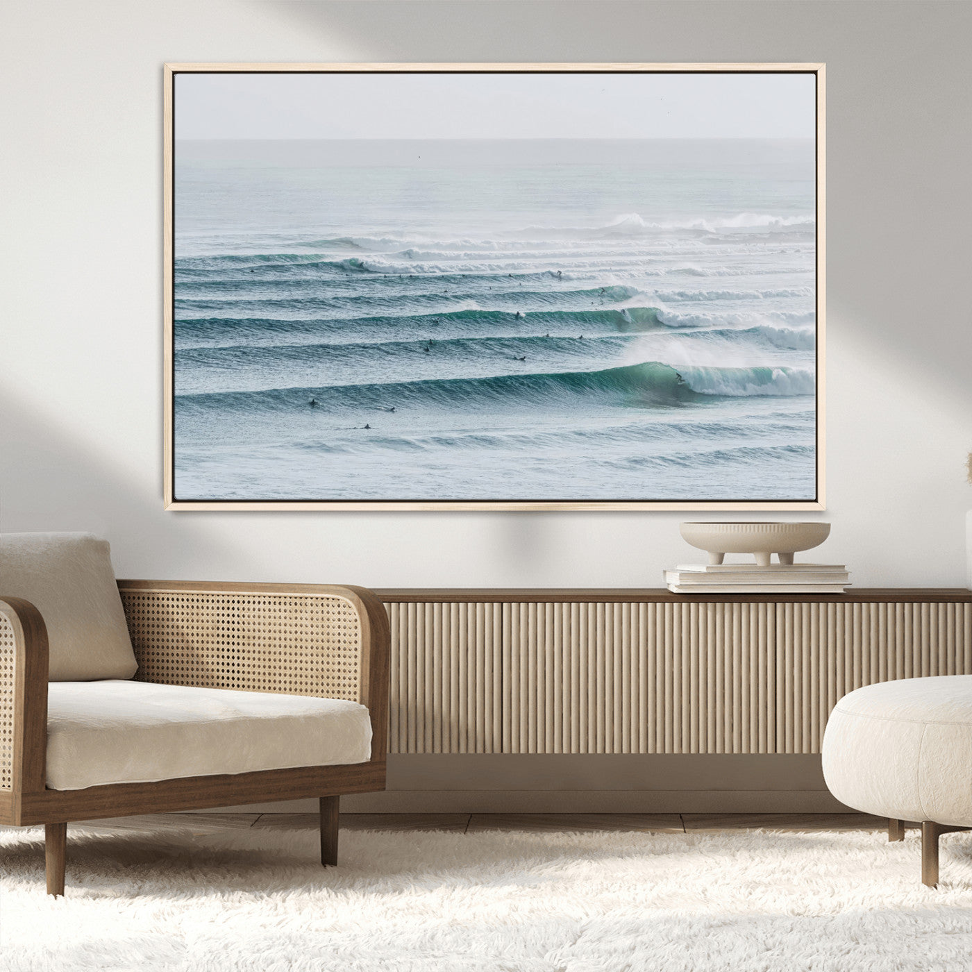 High-angle view of surfers lining up across layered ocean waves, ideal for minimal coastal or surf-inspired room decor.