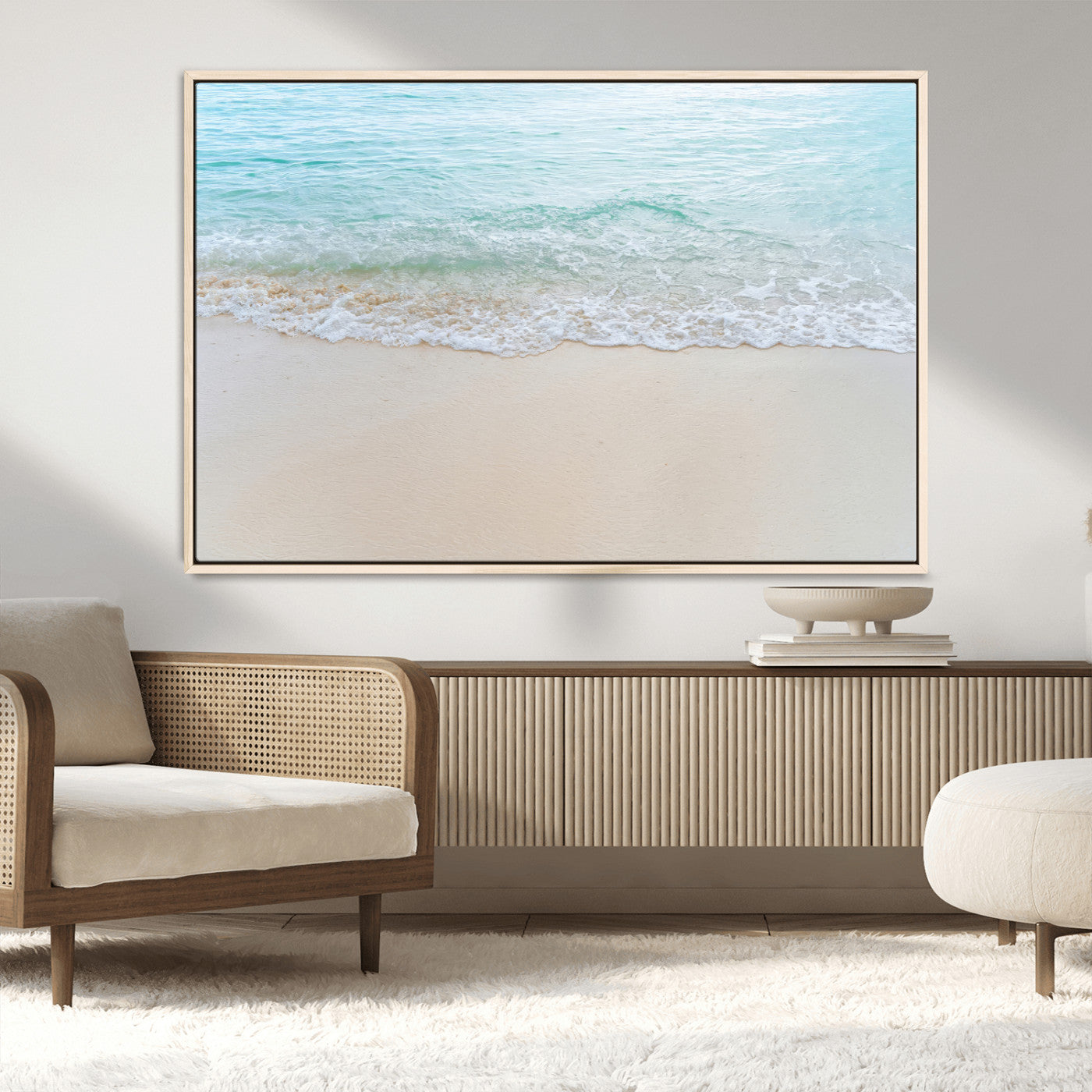 Soft shoreline with gentle aqua waves on smooth sand, ideal for minimalist coastal or pastel ocean-inspired home wall decor.