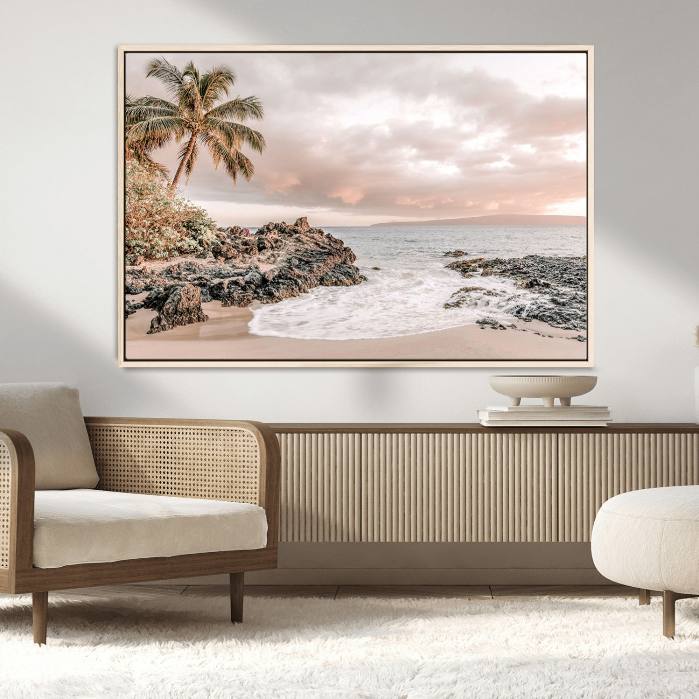 A peaceful beach scene with a palm tree and rocks, soft waves washing onto the shore under a soft pastel sky at sunset.