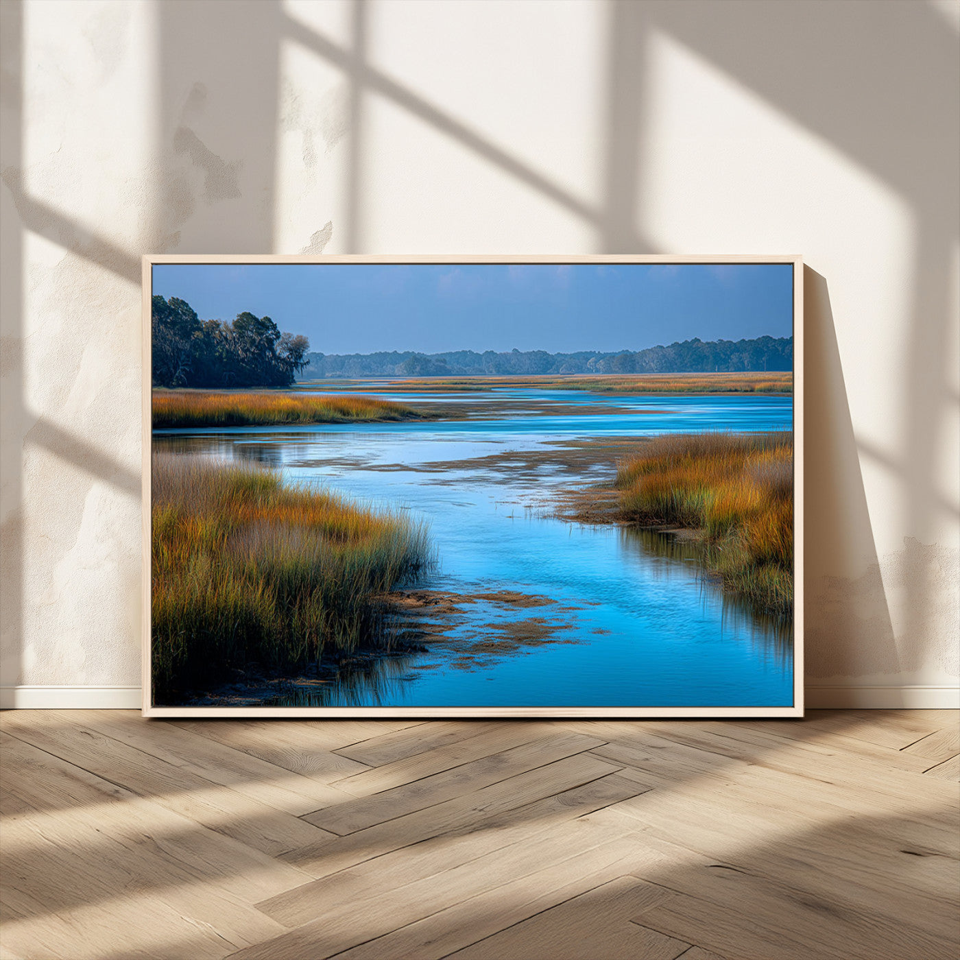 A peaceful marshland scene with calm blue water reflecting the surrounding grasses and trees, capturing the beauty of nature in a serene landscape.