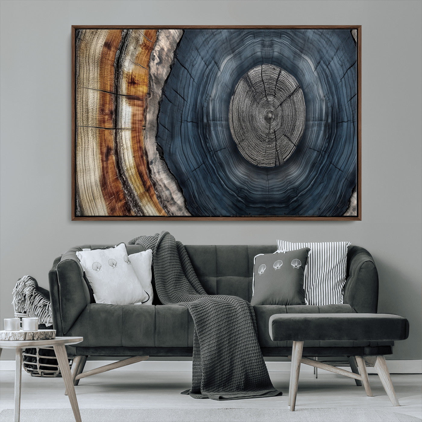 A stunning close-up of a tree trunk showing the intricate, circular growth rings, showcasing the natural textures and rich contrasts in deep blues, browns, and silvers.