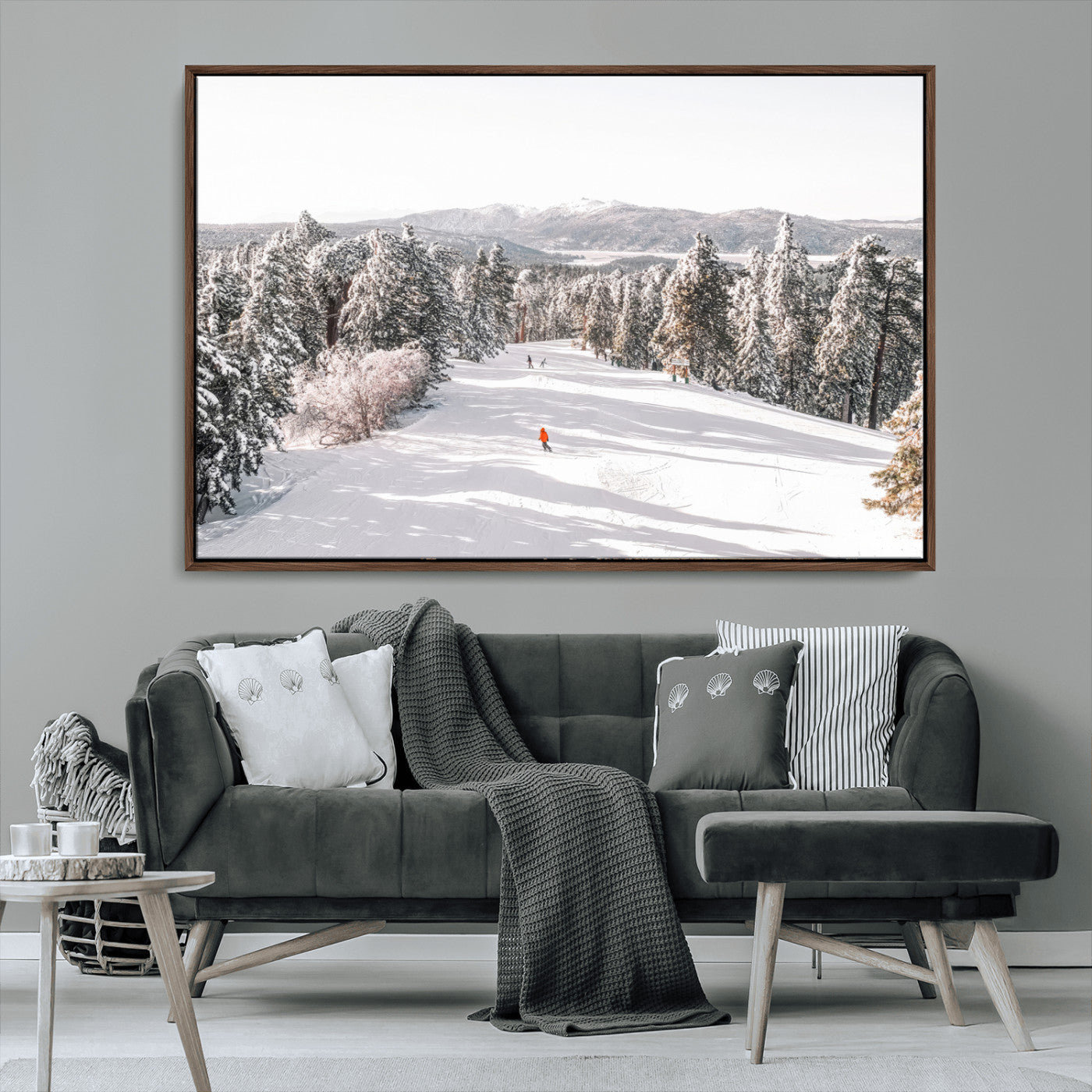 Bright ski trail lined with snow-covered pines and a skier in orange, perfect for alpine adventure or winter sports-inspired decor.