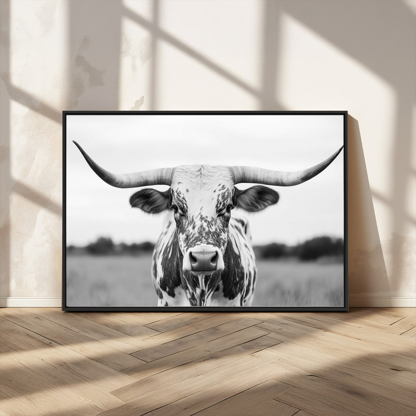 Capture the strength and elegance of nature with this striking black and white portrait of a longhorn cow. Its powerful presence makes a bold statement in any room.