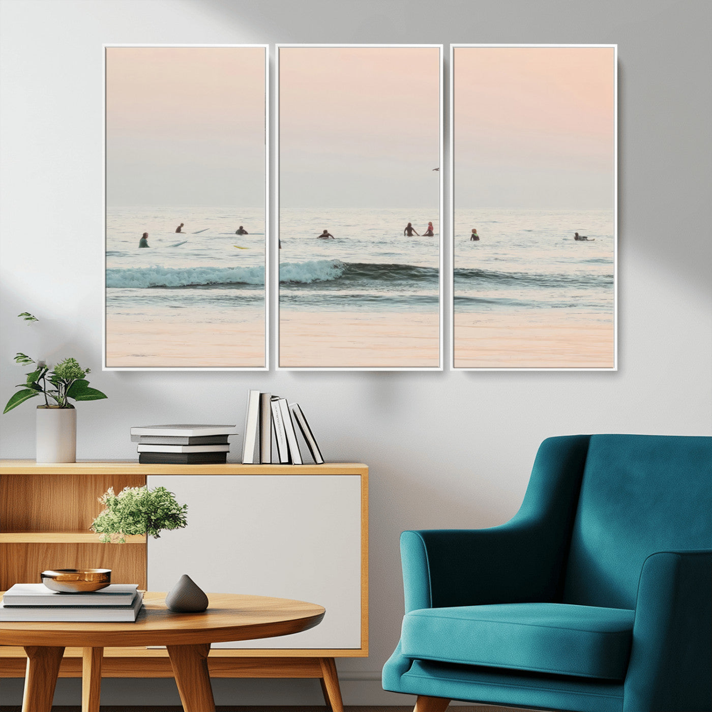 Dreamy photo of surfers waiting on soft pastel waves under a pink sunset sky, ideal for soft coastal minimalist or serene ocean-themed home decor.