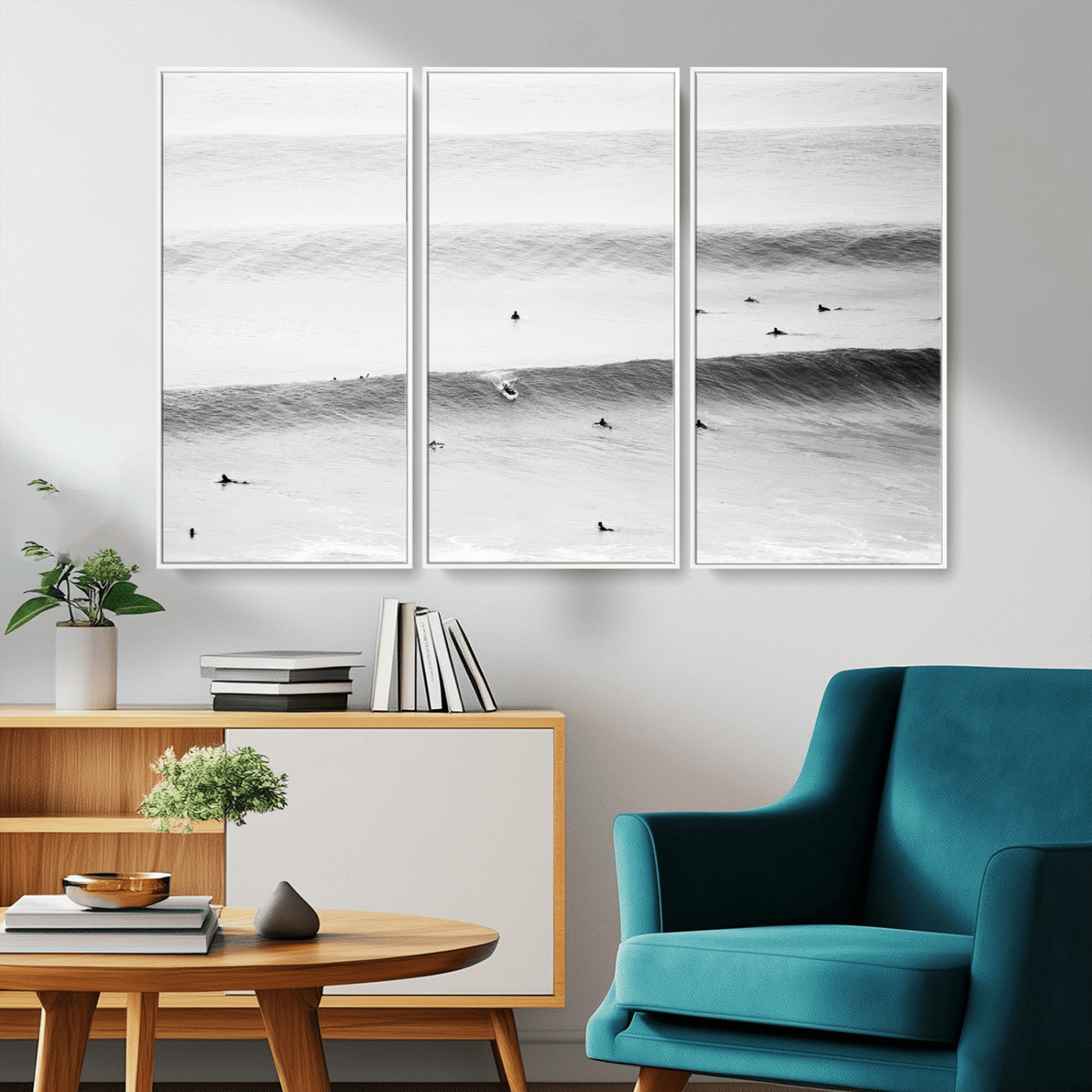 A monochrome photograph of swimmers gliding through gentle ocean waves, evoking a sense of calm and movement.