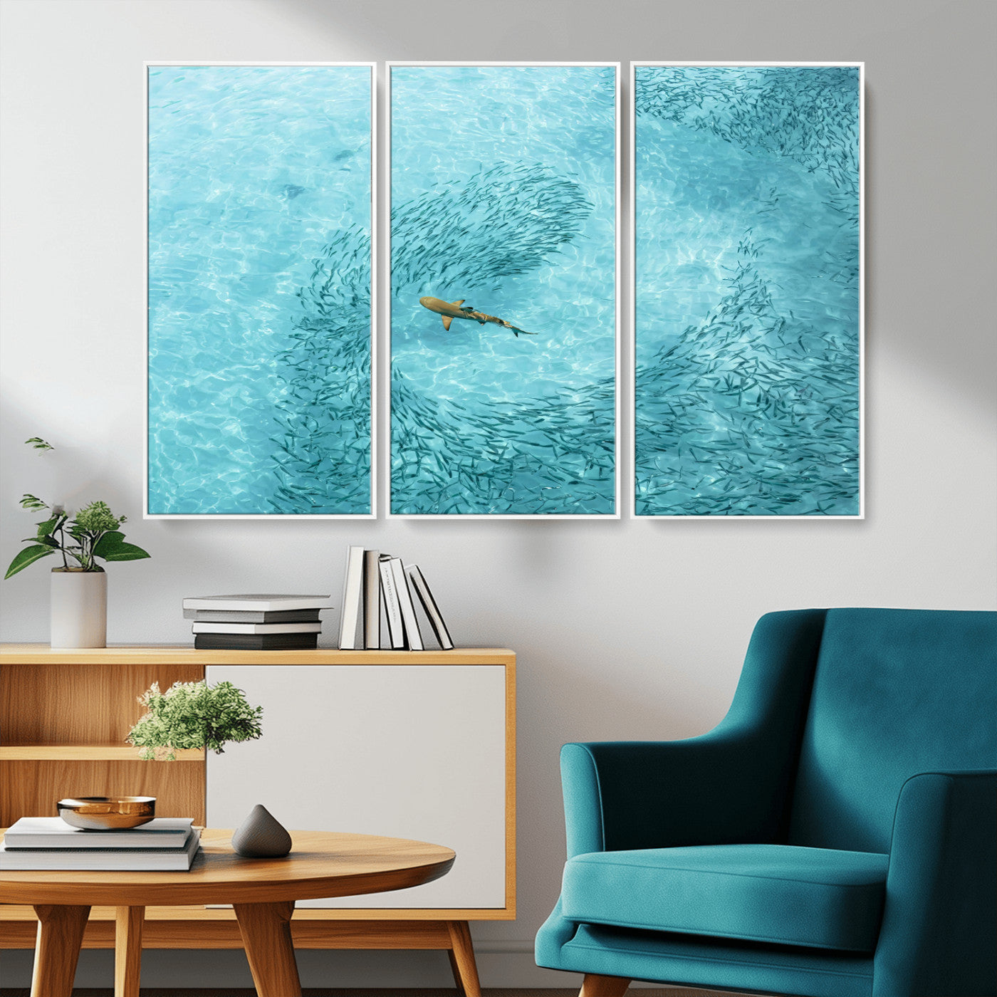 Aerial view of a shark swimming through a swirl of fish in clear turquoise waters, perfect for calm coastal or beach house decor.