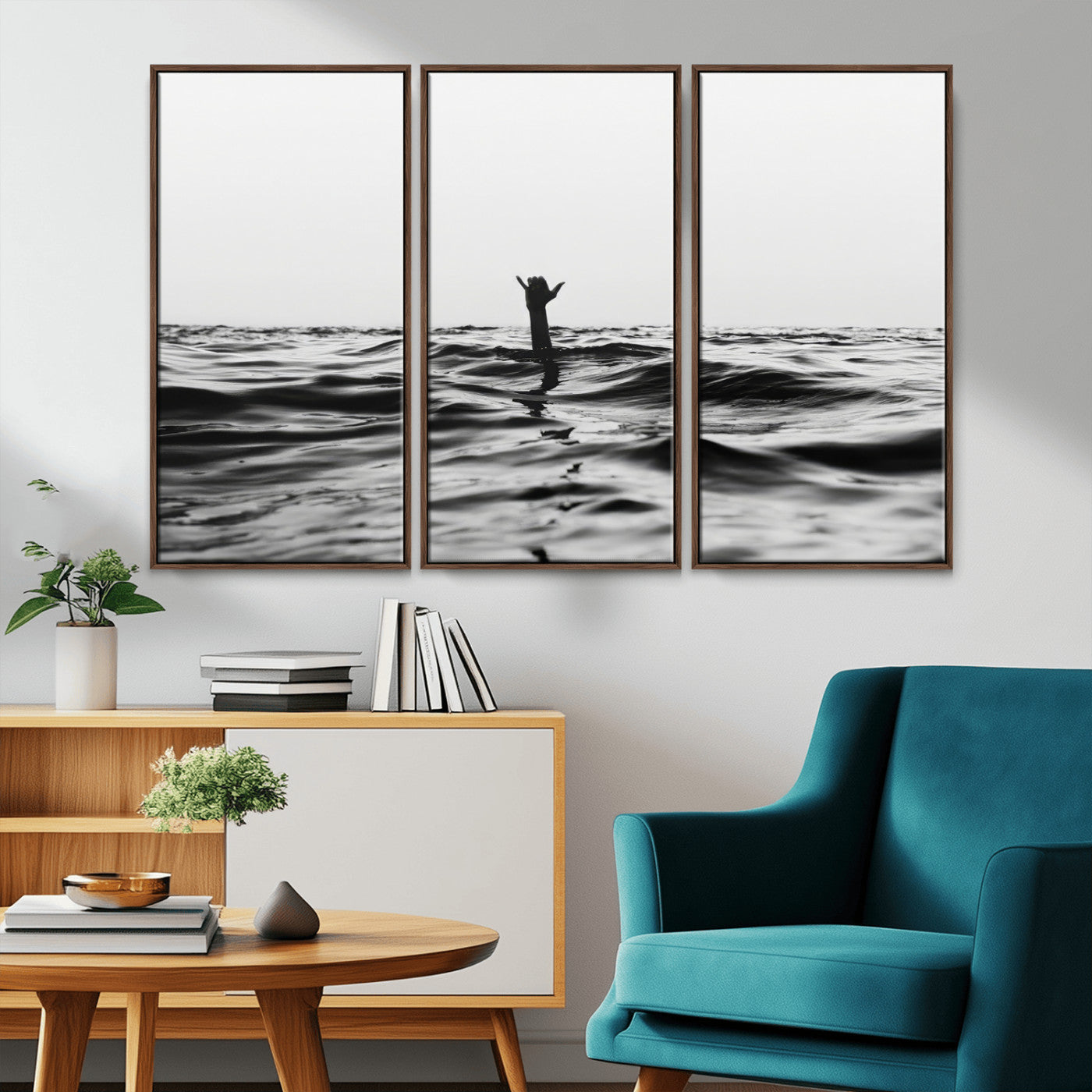 Black and white ocean with a hand making a surfer sign among dark waves, creating a dramatic and minimalist seascape with bold contrast.