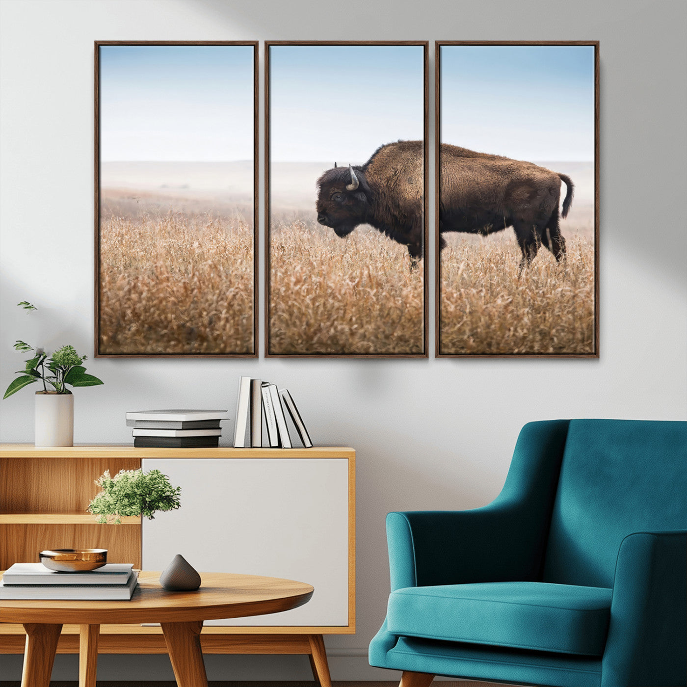 A majestic bison standing in an open prairie field, its strong form blending into the golden grass under a vast blue sky, evoking the wild spirit of the American plains.
