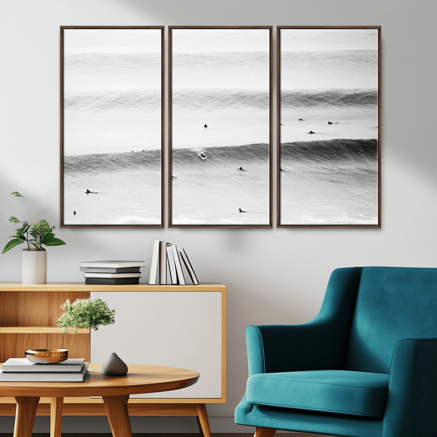 A monochrome photograph of swimmers gliding through gentle ocean waves, evoking a sense of calm and movement.