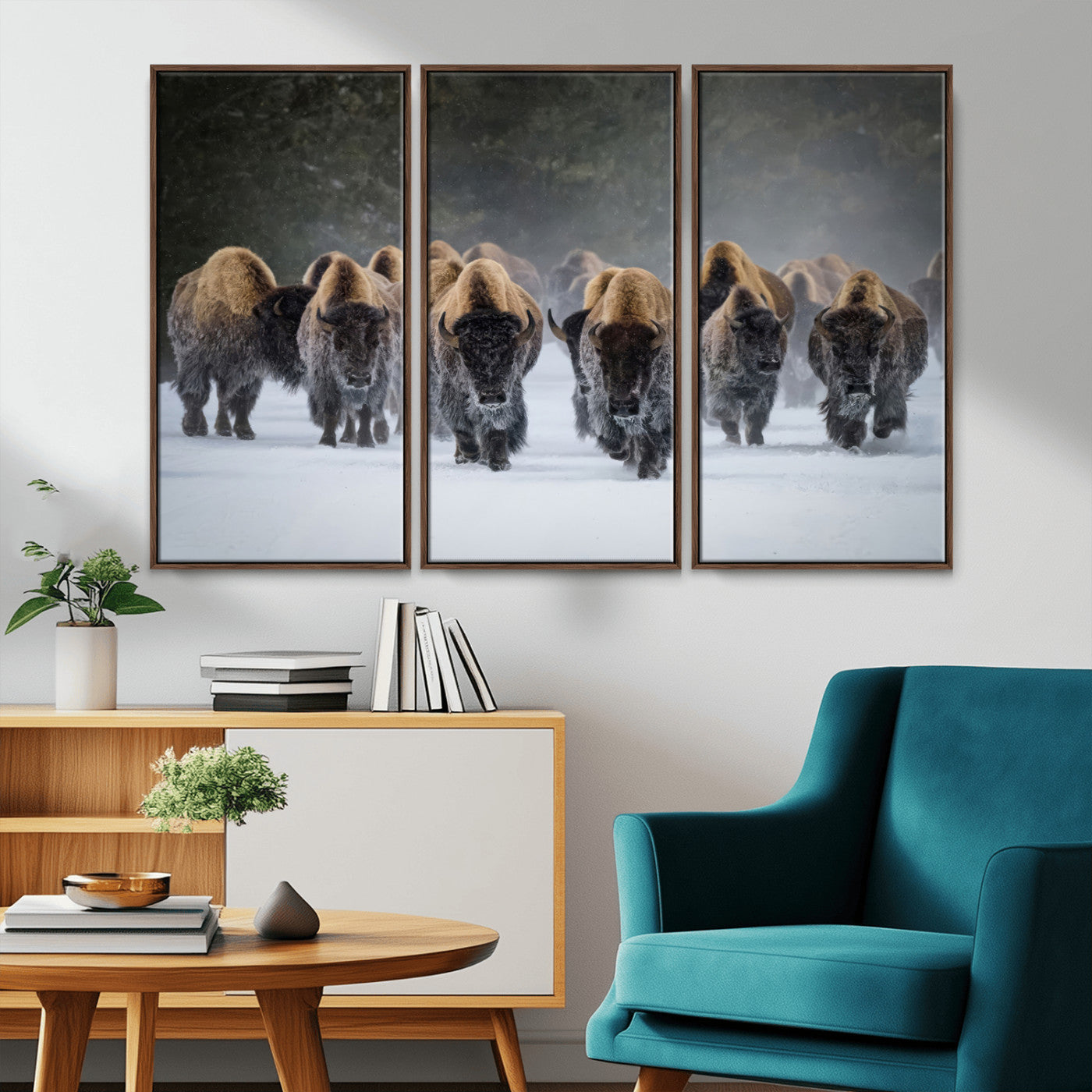 A herd of American bisons walking through deep snow in a forest, evoking a powerful rustic wilderness mood for western-style interiors.