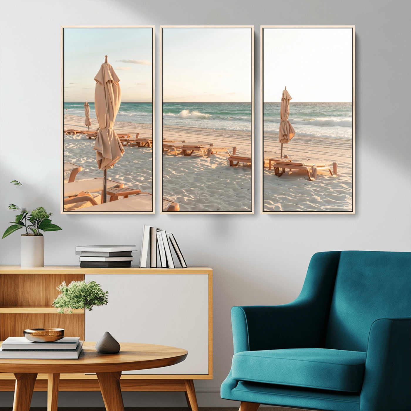 Minimalist photo of empty beach loungers and umbrellas on soft sand, ideal for calm seaside or pastel coastal-style home decor.