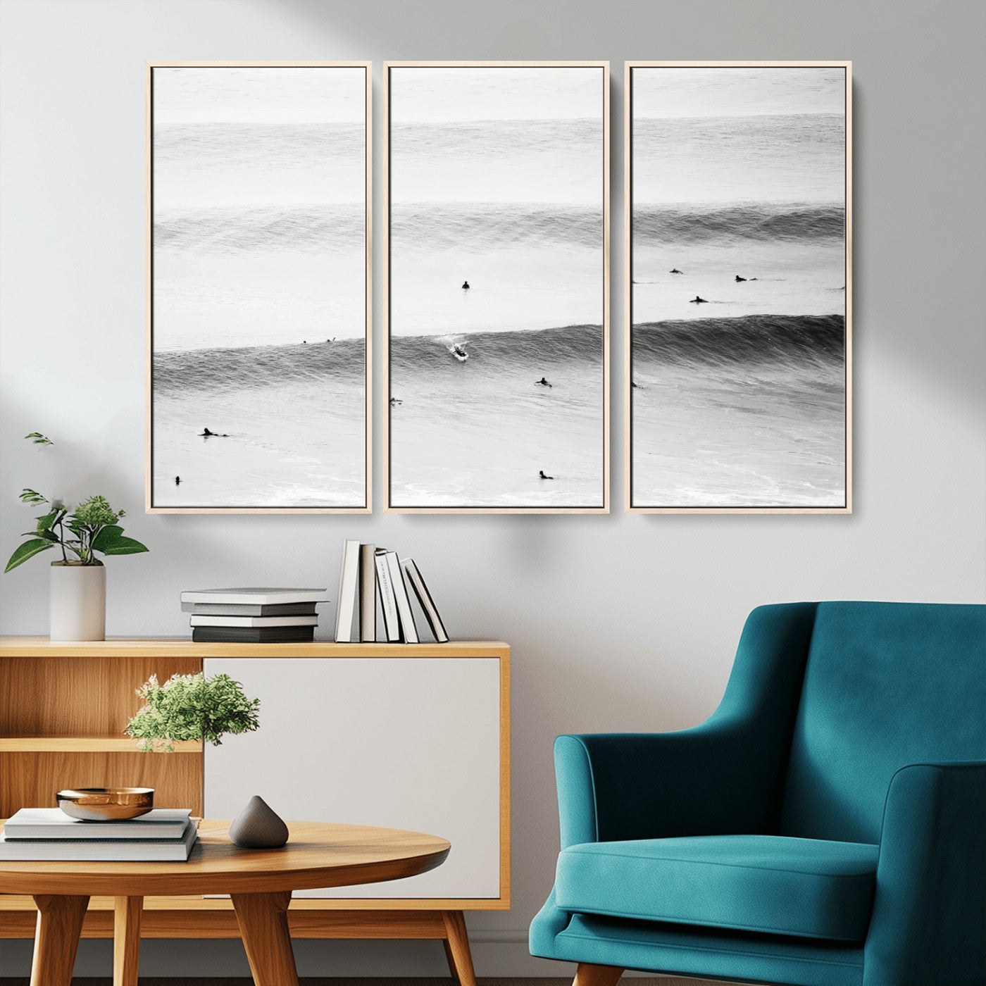 A monochrome photograph of swimmers gliding through gentle ocean waves, evoking a sense of calm and movement.