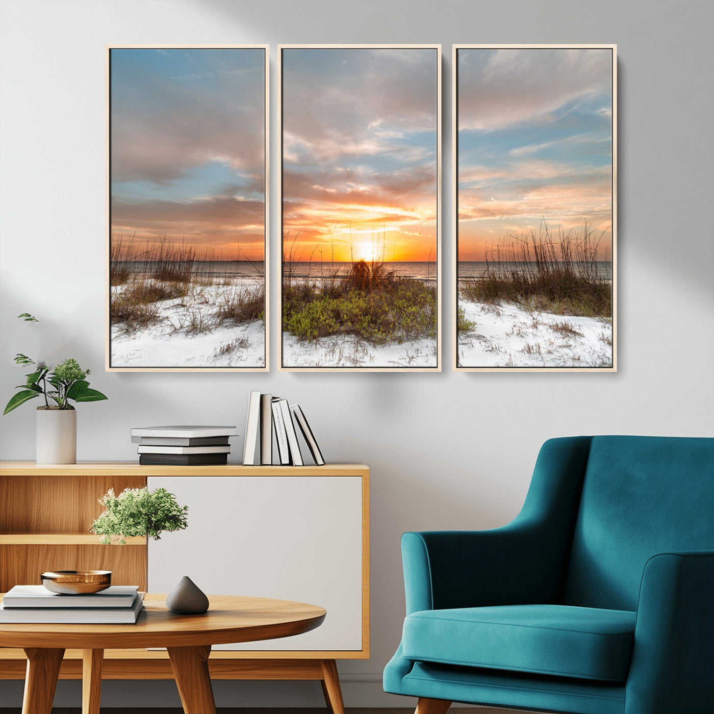 A tranquil beach scene featuring golden sunset hues over the water, with grasses in the foreground and a peaceful, serene atmosphere.