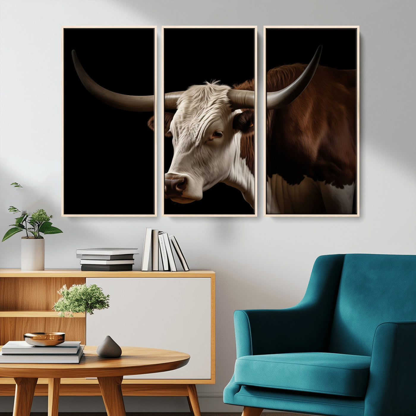 "Close-up of a brown and white longhorn cow with prominent curved horns against a black background."