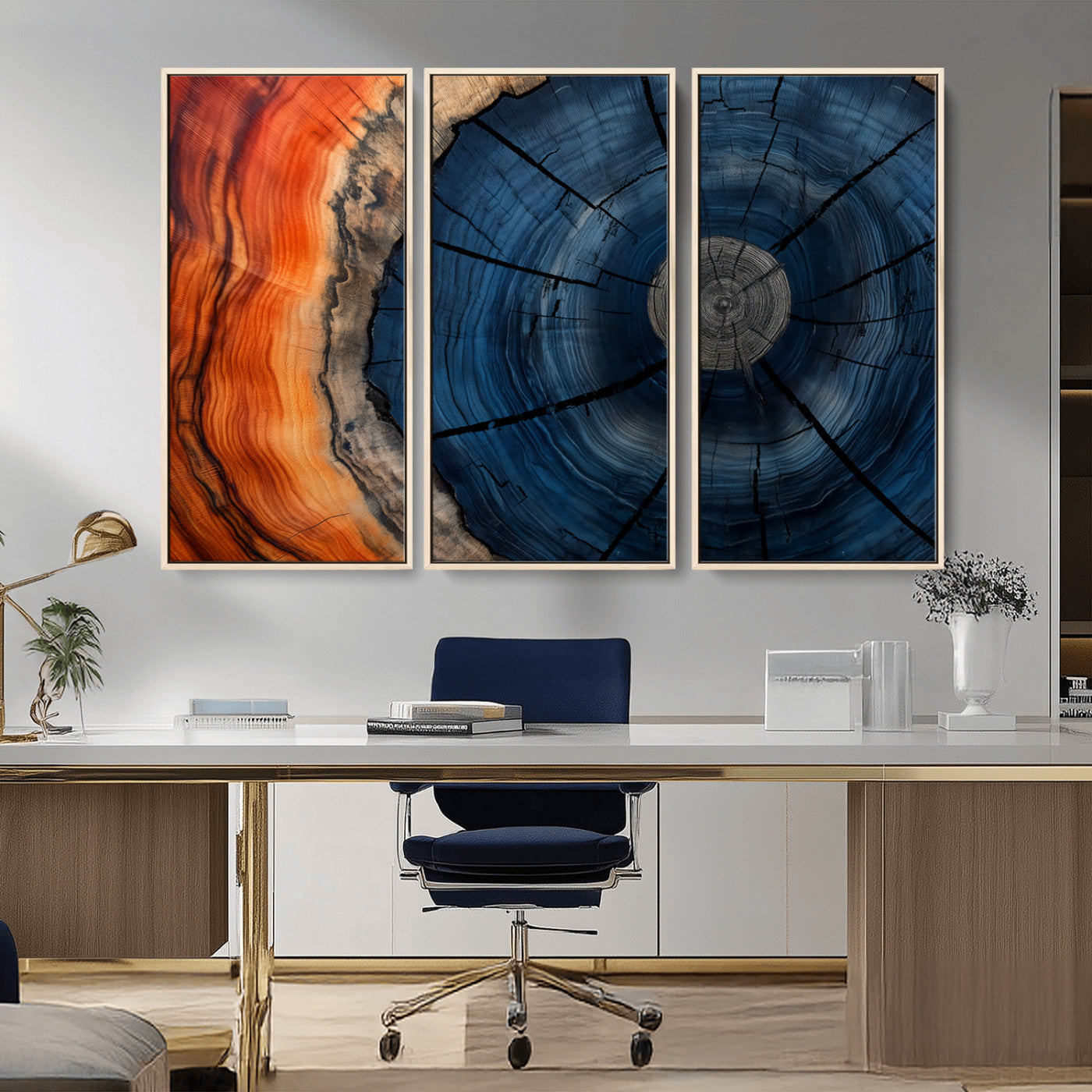 A captivating close-up of a tree trunk, showcasing its concentric rings in rich shades of blue, orange, and brown, highlighting the organic patterns of natural wood.