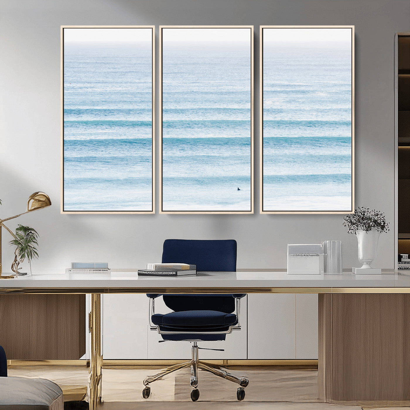 Minimalist ocean view with soft blue waves and a lone surfer, creating a serene and airy coastal aesthetic, perfect for tranquil home decor.
