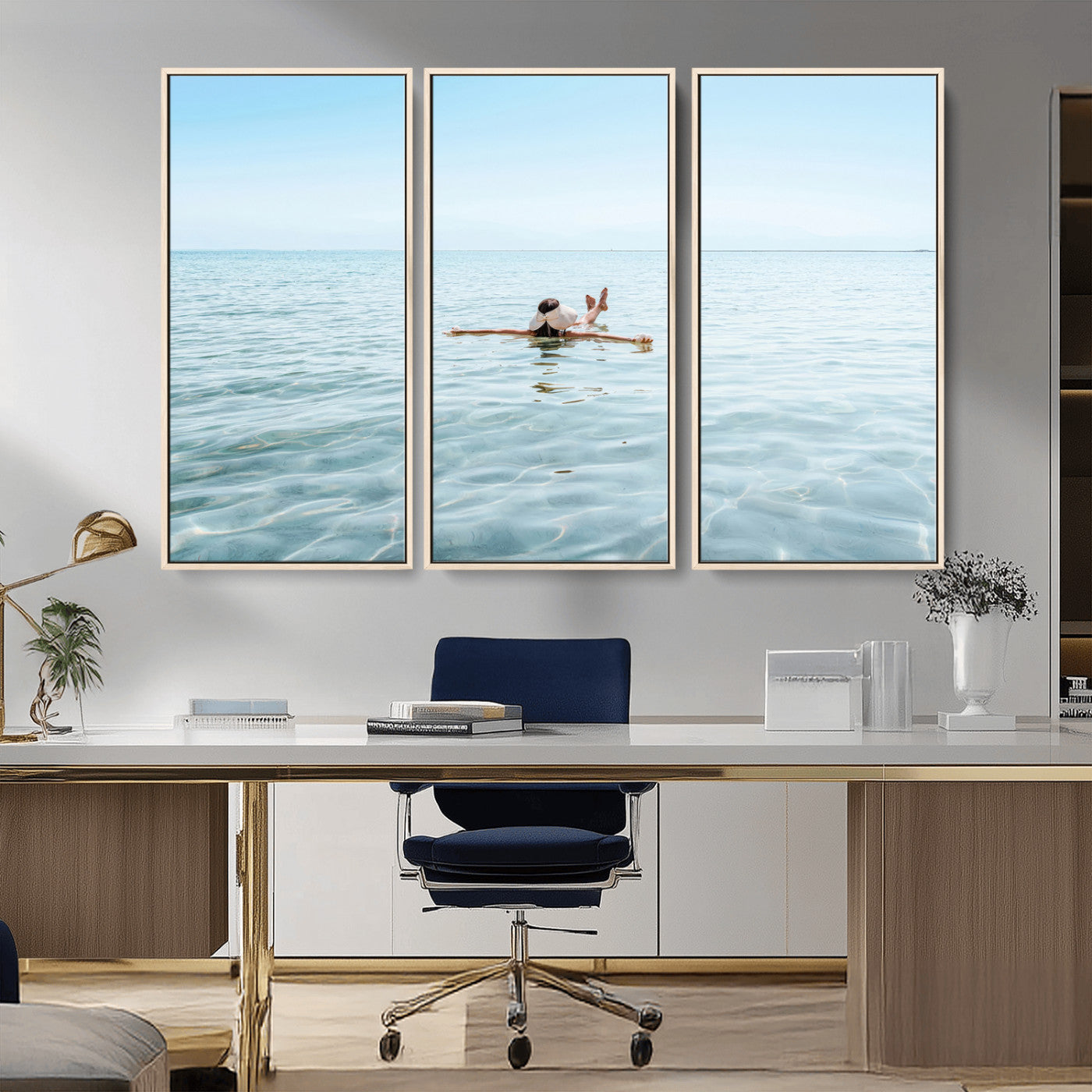 A peaceful minimalist scene of a person floating on crystal-clear water, surrounded by a vast open horizon, capturing relaxation and serenity in a tranquil aquatic setting.