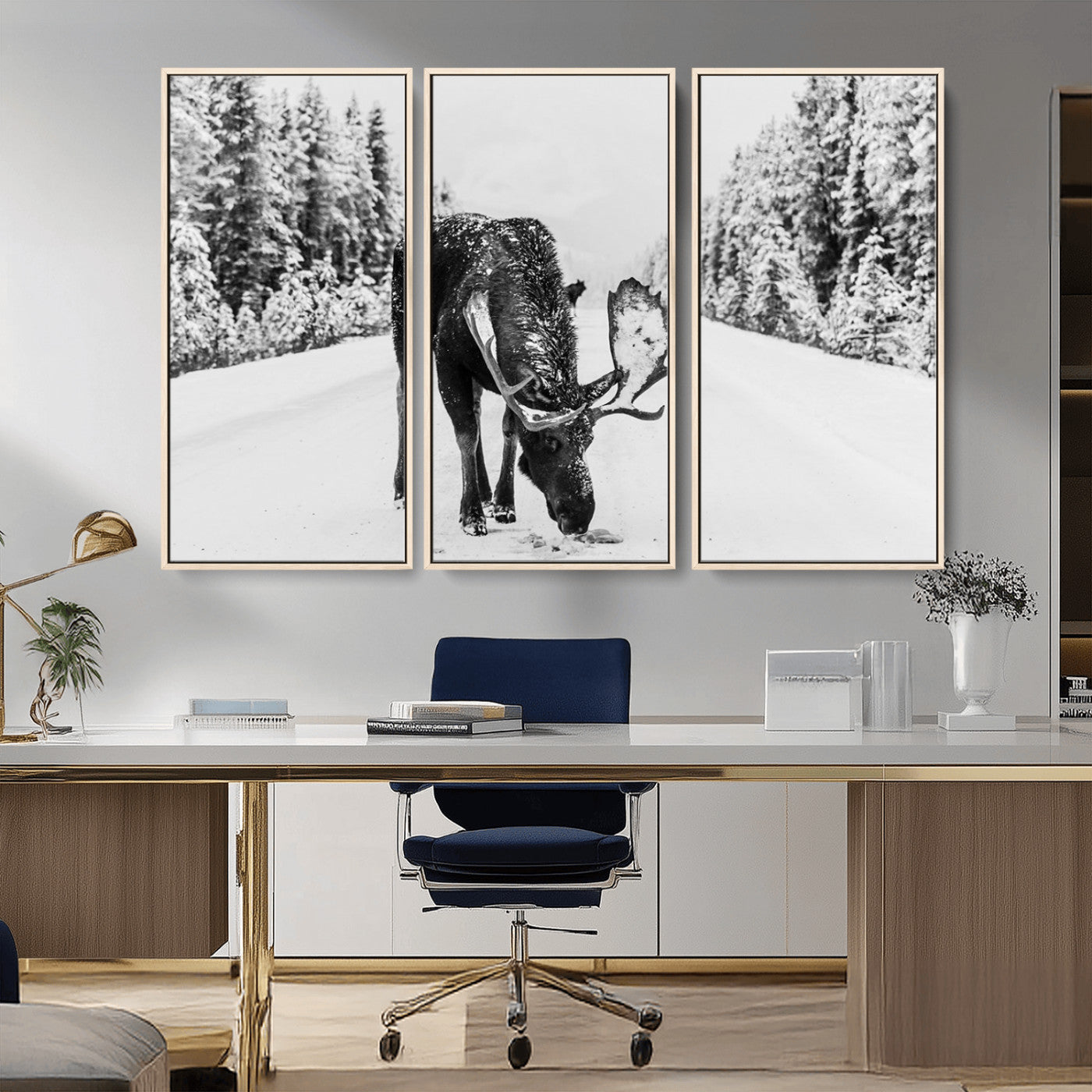A majestic moose grazing in the snow-covered wilderness, surrounded by snow-covered trees, creating a peaceful winter scene.