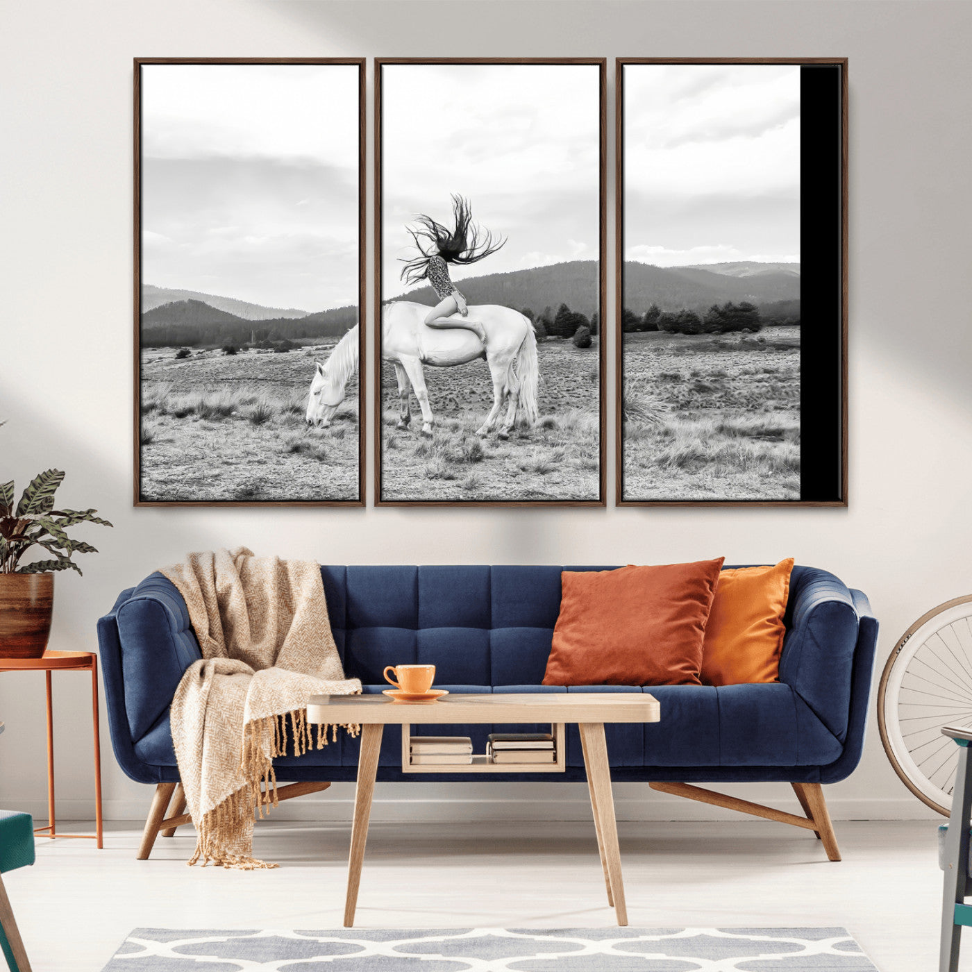 Black and white photo of a woman on a white horse in moody tones, ideal for Western Boho or modern rustic-style home decor.