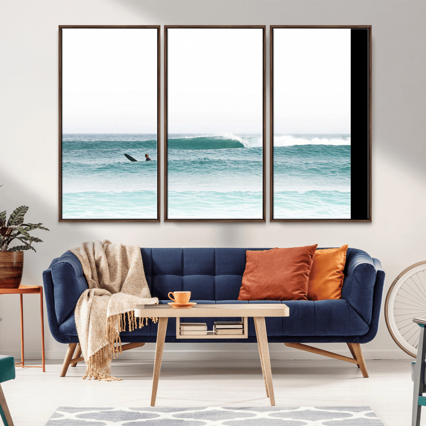 Minimalist photo of a lone surfer on calm aqua waves under bright sky, perfect for Scandinavian coastal or serene ocean-inspired home decor.