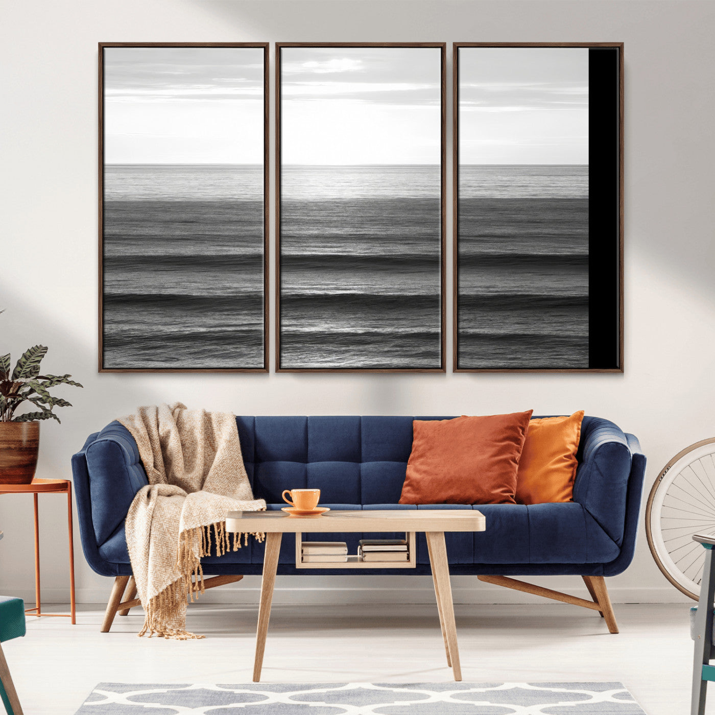 Minimalist black and white ocean view with layered waves reflecting sunlight, evoking a sense of calm and coastal serenity.