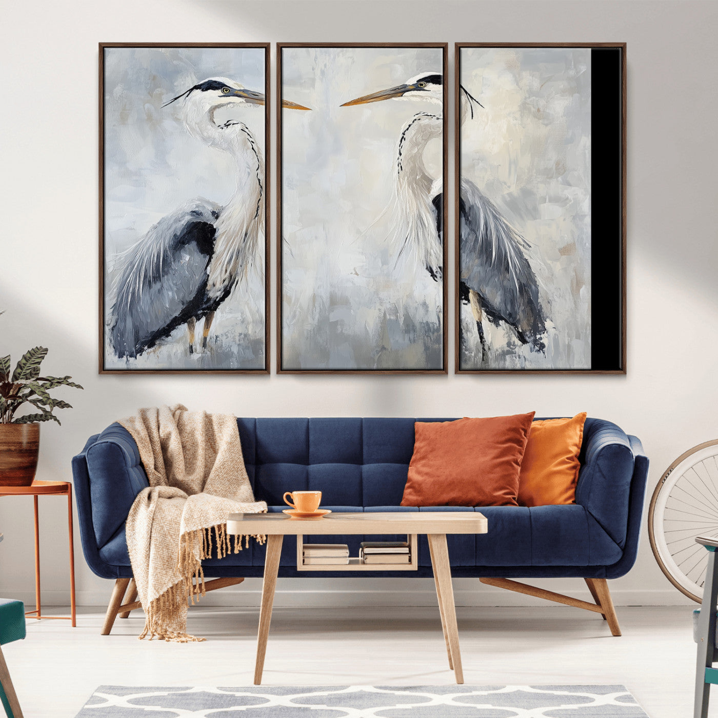 Two herons facing each other on a soft-toned background with blue-grey feathers, perfect for tranquil, coastal or nature-themed interiors.