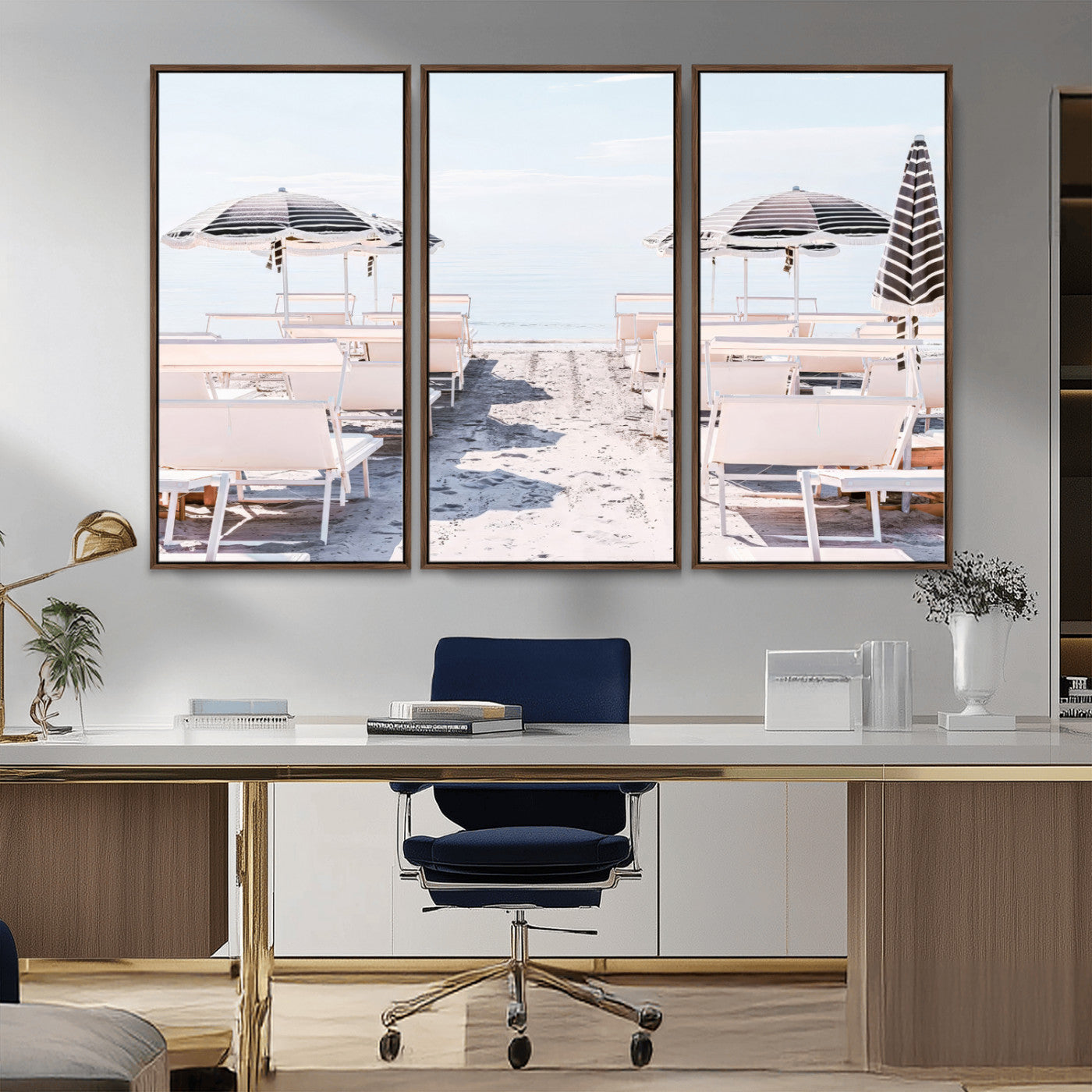 A serene minimalist beach scene featuring striped umbrellas, soft pastel sand, and an elegant lounge setup, creating a tranquil and stylish coastal retreat.
