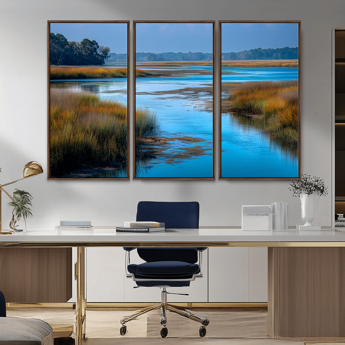 A peaceful marshland scene with calm blue water reflecting the surrounding grasses and trees, capturing the beauty of nature in a serene landscape.