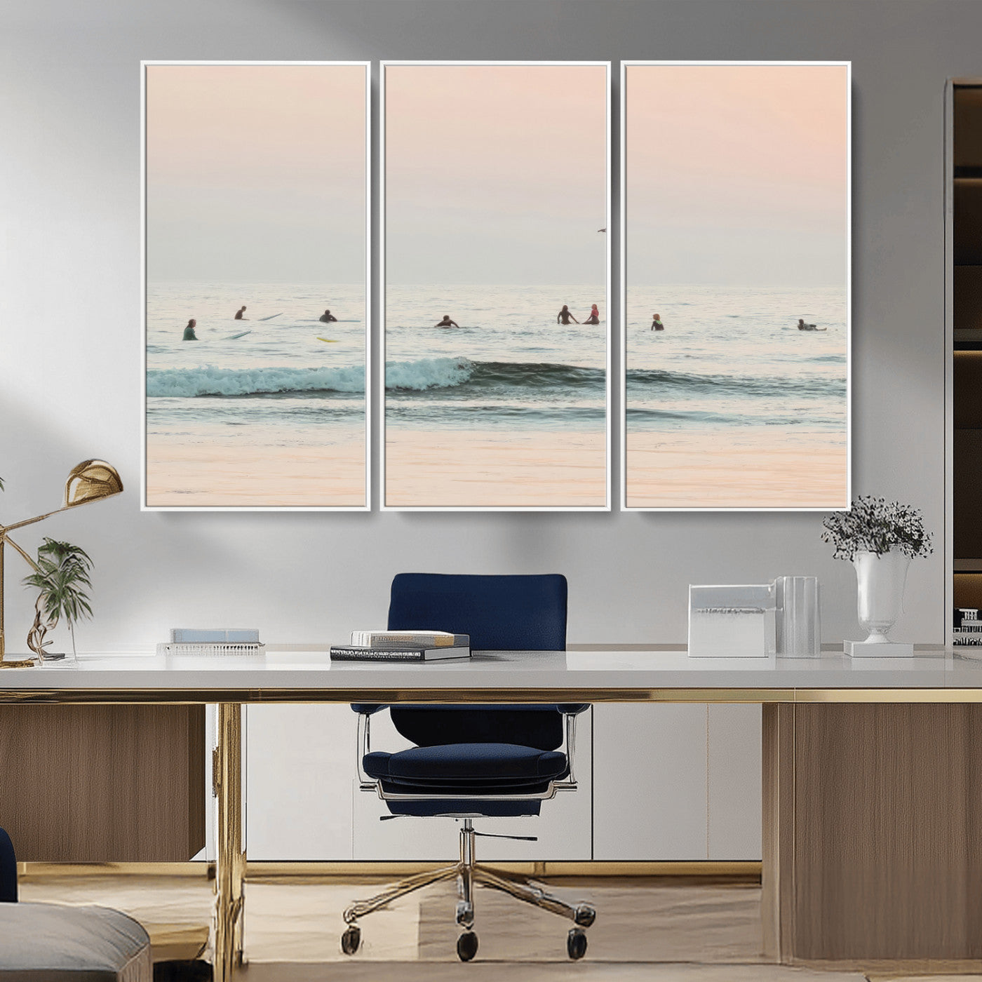Dreamy photo of surfers waiting on soft pastel waves under a pink sunset sky, ideal for soft coastal minimalist or serene ocean-themed home decor.
