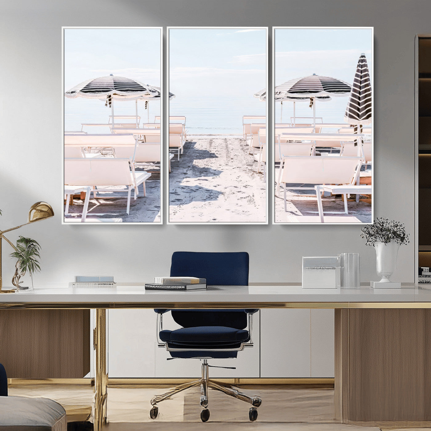 A serene minimalist beach scene featuring striped umbrellas, soft pastel sand, and an elegant lounge setup, creating a tranquil and stylish coastal retreat.