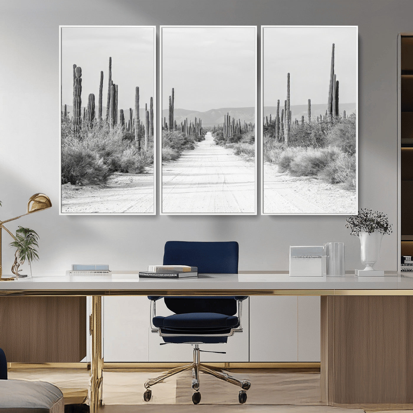 A black and white desert road stretching through a cactus-filled landscape, creating a rugged and timeless southwestern aesthetic with a sense of adventure.