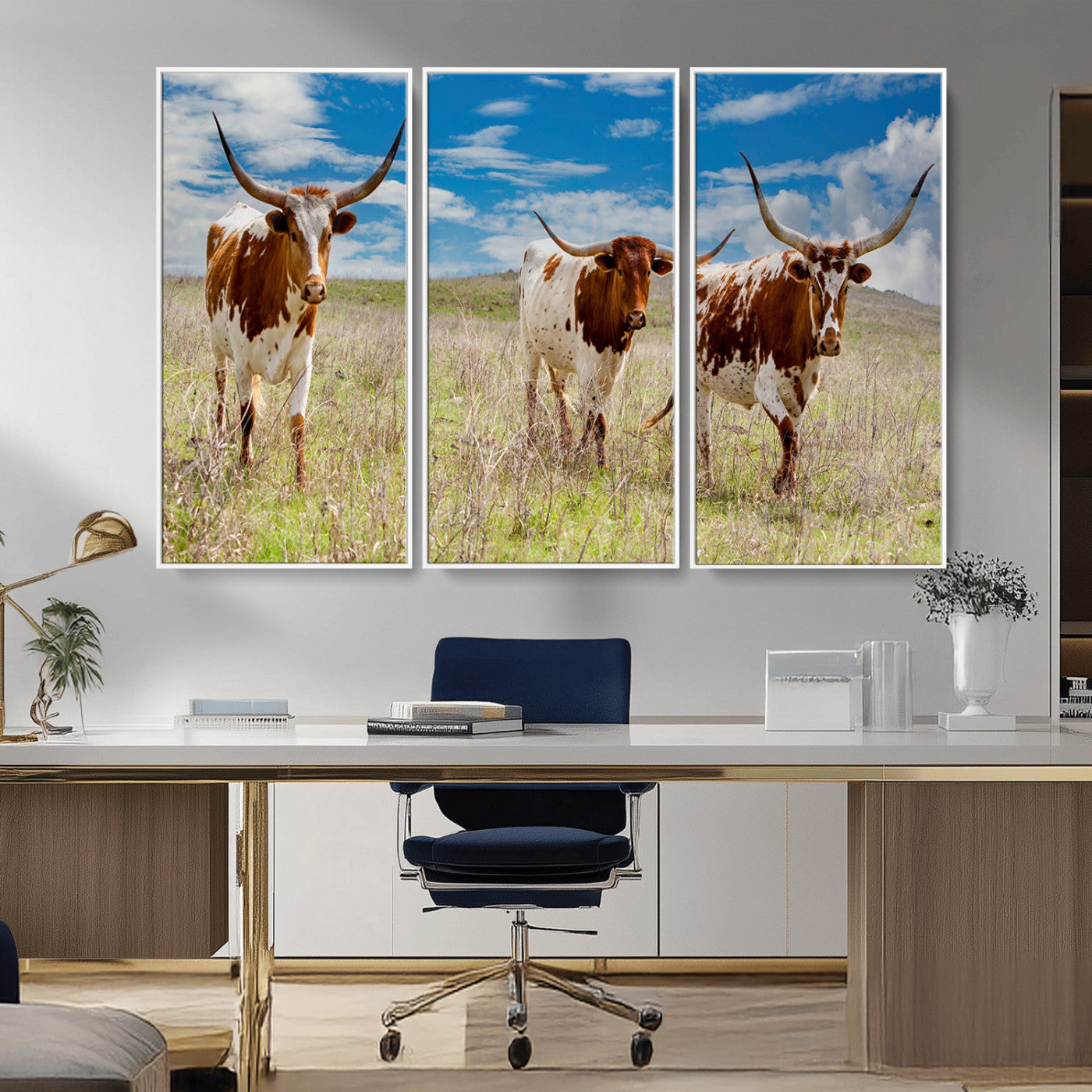 Three Texas longhorn cattle standing in dry grass under a bright blue sky, ideal for farmhouse or western rustic home decor.