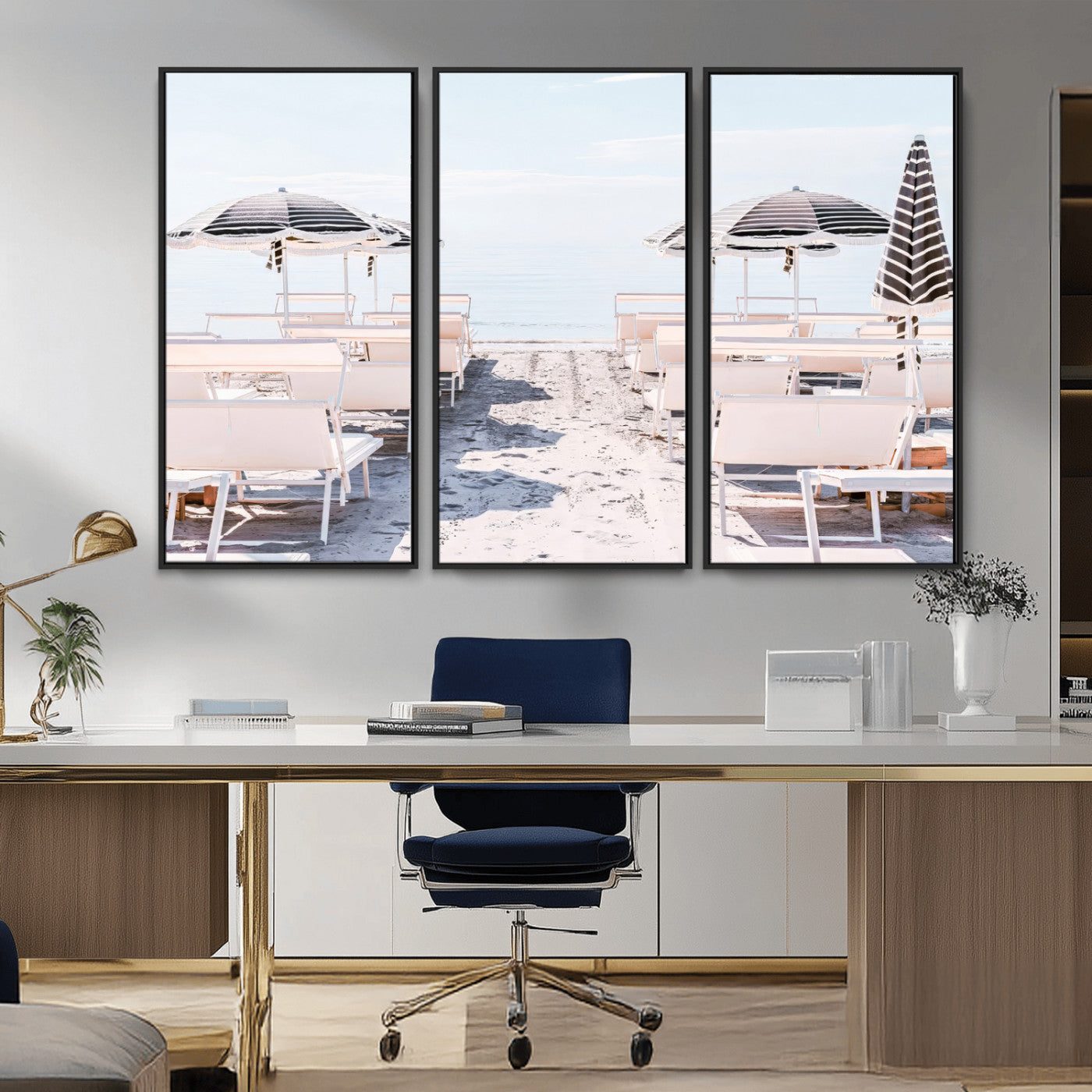 A serene minimalist beach scene featuring striped umbrellas, soft pastel sand, and an elegant lounge setup, creating a tranquil and stylish coastal retreat.