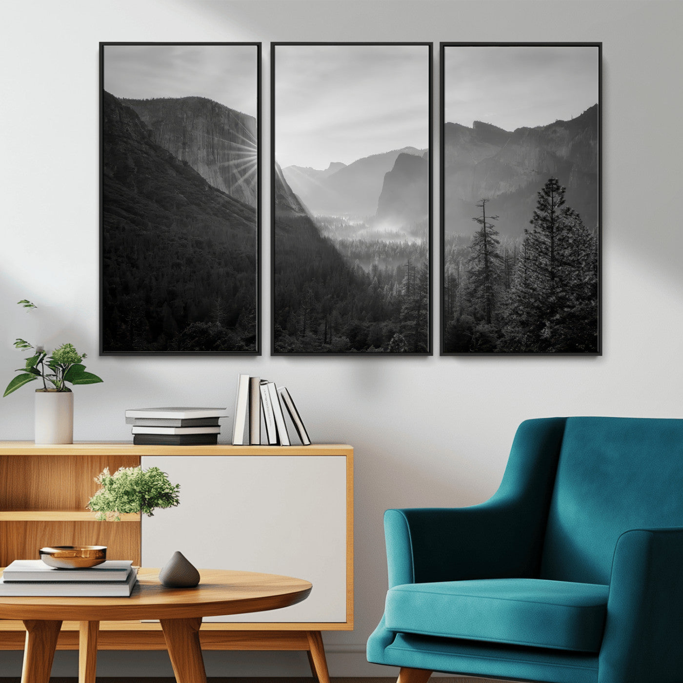 Black and white landscape of Yosemite with sun rays peeking over El Capitan, ideal for moody nature or modern rustic decor.