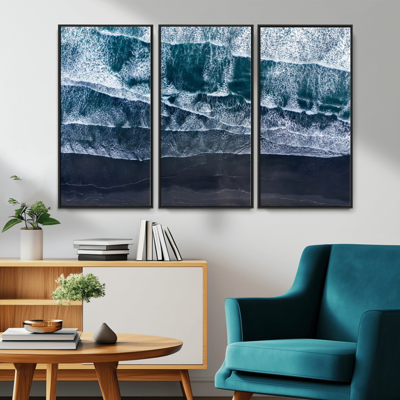 Canvas of aerial ocean waves crashing onto a black sand beach in moody tones, ideal for modern coastal or minimalist home decor.