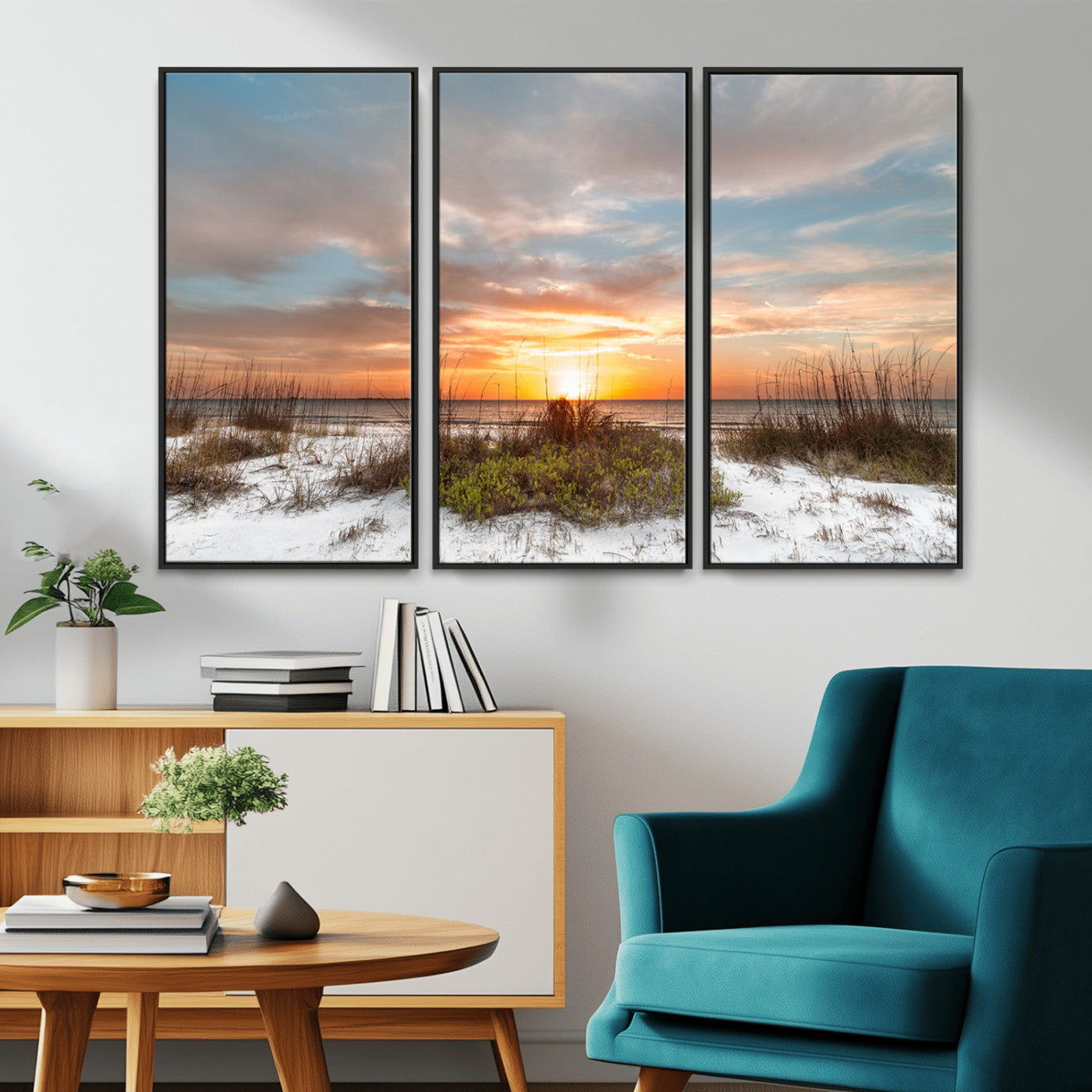 A tranquil beach scene featuring golden sunset hues over the water, with grasses in the foreground and a peaceful, serene atmosphere.