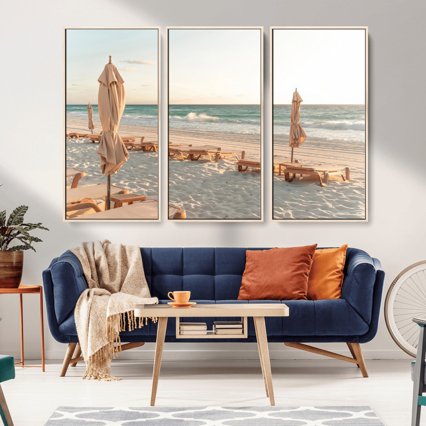 Minimalist photo of empty beach loungers and umbrellas on soft sand, ideal for calm seaside or pastel coastal-style home decor.